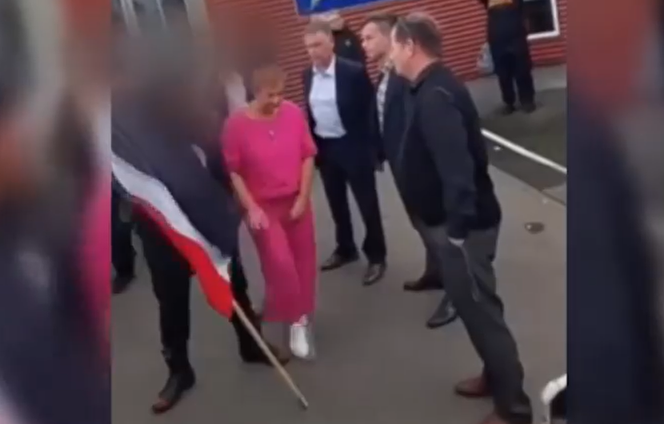 A Freyberg High School student appears to spit at the shoes of Act leader David Seymour during a school visit in Palmerston North. Photo / via video