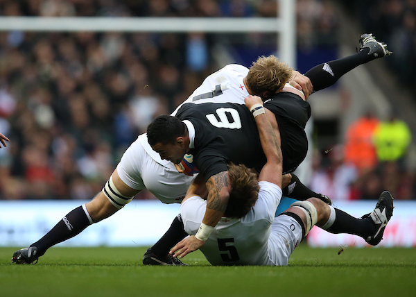 All Blacks flanker Liam Messam is brought down by Chris Robshaw and Joe Launchbury. Photo / Photosport