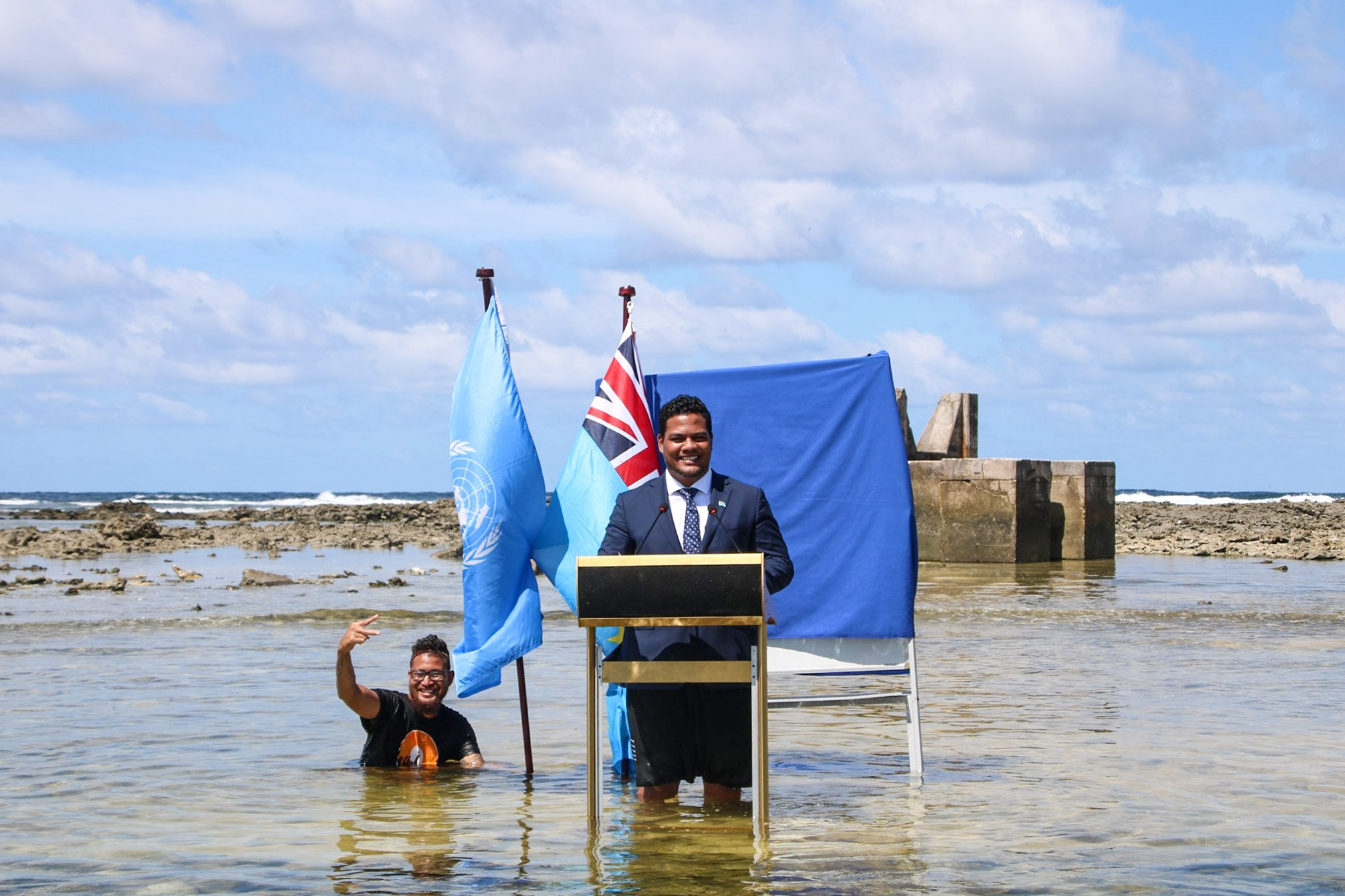 Tuvalu's Minister of Foreign Affairs, Simon Kofe, makes a statement at the UN's climate conference, in 2021, as he gives his speech while standing in the ocean. Photo / Facebook