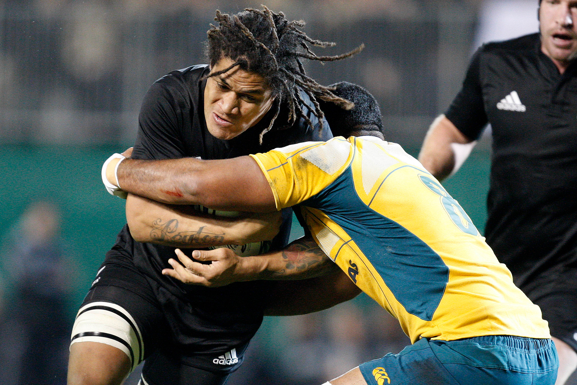 Rodney So'oialo is tackled by Australia's Wycliff Palu in the first Tri-Nations rugby test of the year 2009. Photo / NZPA
