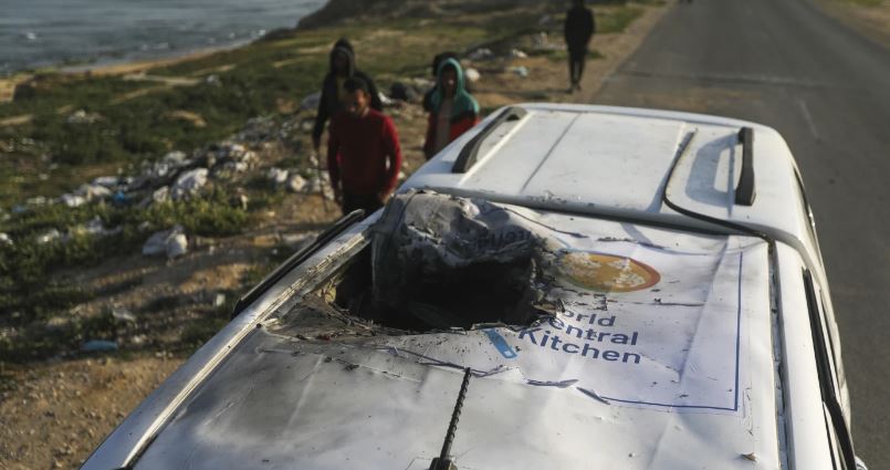 Palestinians inspect a vehicle bearing the logo of the World Central Kitchen which was wrecked by an Israeli airstrike in Deir al Balah in the Gaza Strip on Tuesday, April 2, 2024. A series of airstrikes killed seven aid workers from the international not-for-profit, leading it to suspend delivery of vital food aid to Gaza on Tuesday. Photo / AP