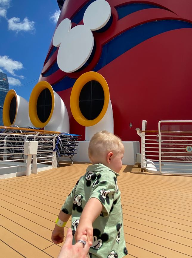 By the time we pass Waiheke Island, it's hard to say who's happier on board the Disney Wonder cruise ship - Max or his mum. Photo / Anna Sarjeant