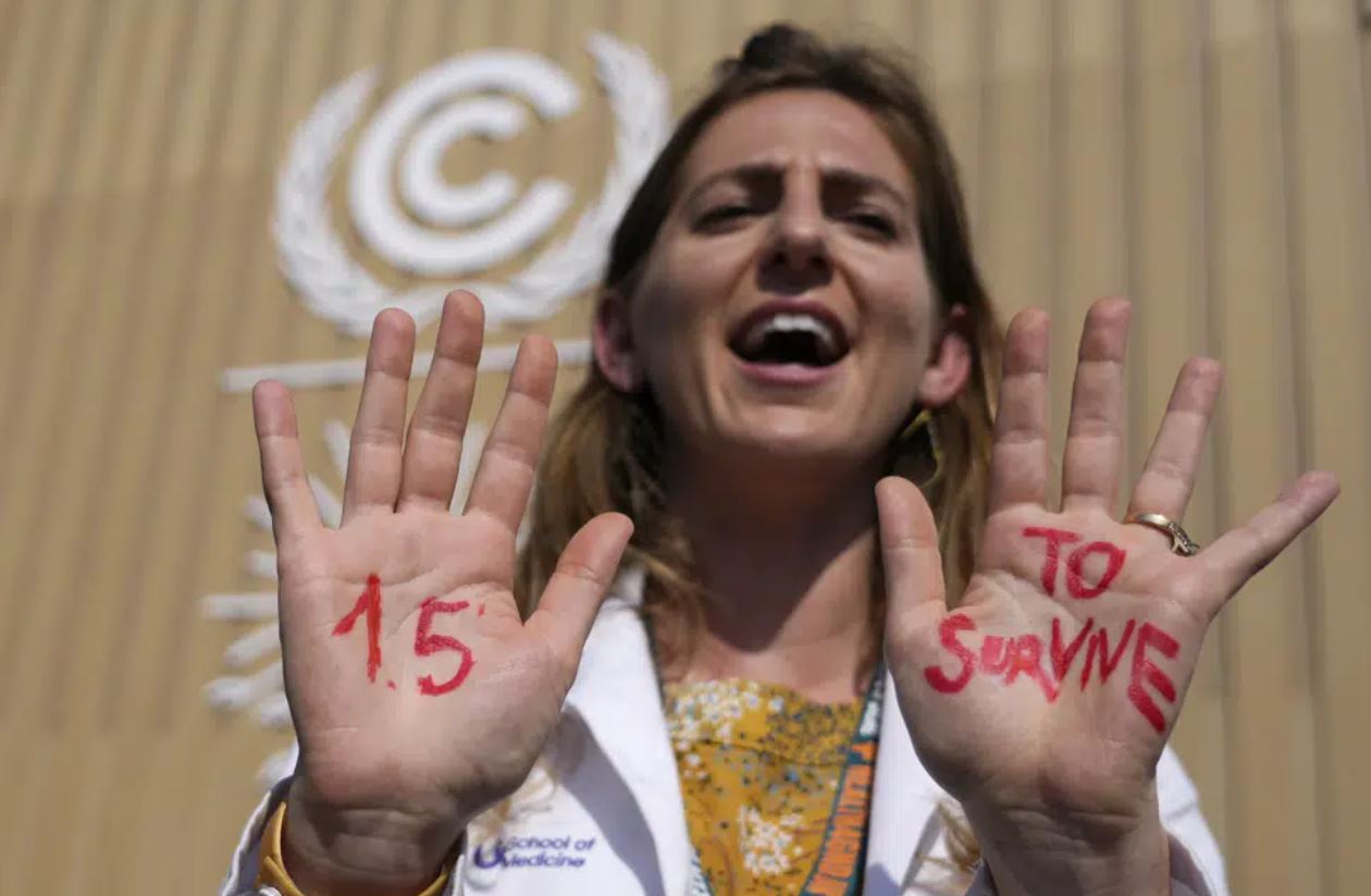 A woman shows her hands reading 