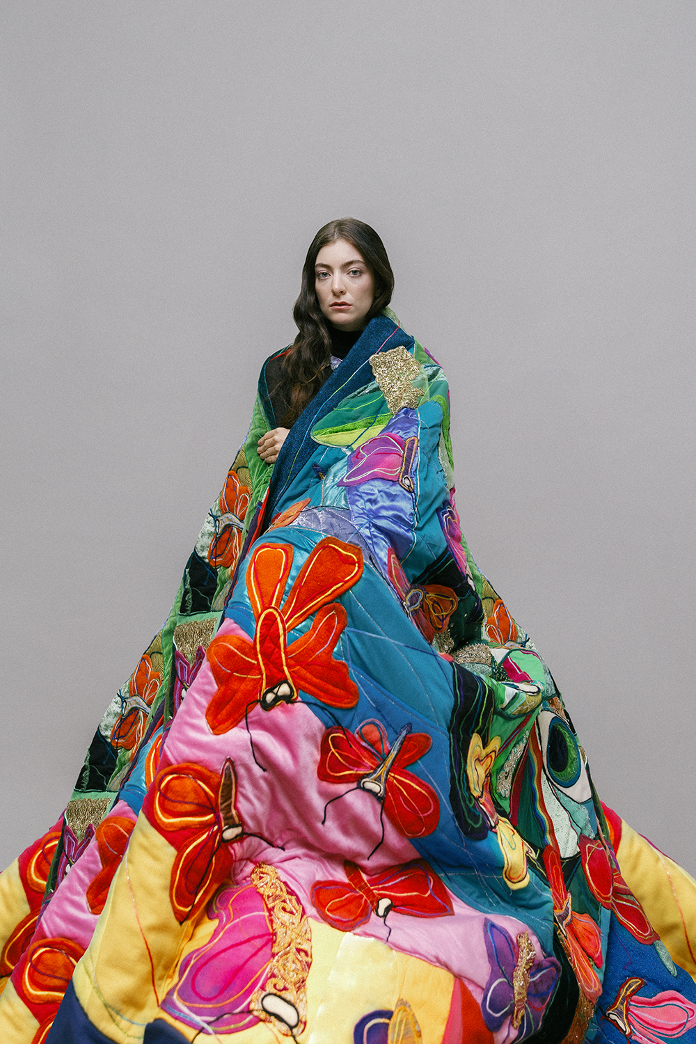 Maungarongo Ron Te Kawa’s vibrant storytelling is lovingly stitched together through the sacred practice of quilt-making. This particular piece, entitled ‘Purerehua’, is symbolic of Lorde’s own creative journey, from hit single Royals to EP Te Ao Marama, the latter’s release sparking polarising opinions. “All my te reo teachers, from primary school through to university and then later at Te Wananga, were non-Maori. So I tautoko Ella hard,” says Ron. ‘Purerehua’ quilt by Ron Te Kawa, 2021 (1760mm x 2400mm). Comme des Garcons polo neck top $680. Ryan Storer necklace (POA). Photographer / Hohua Ropate Kurene