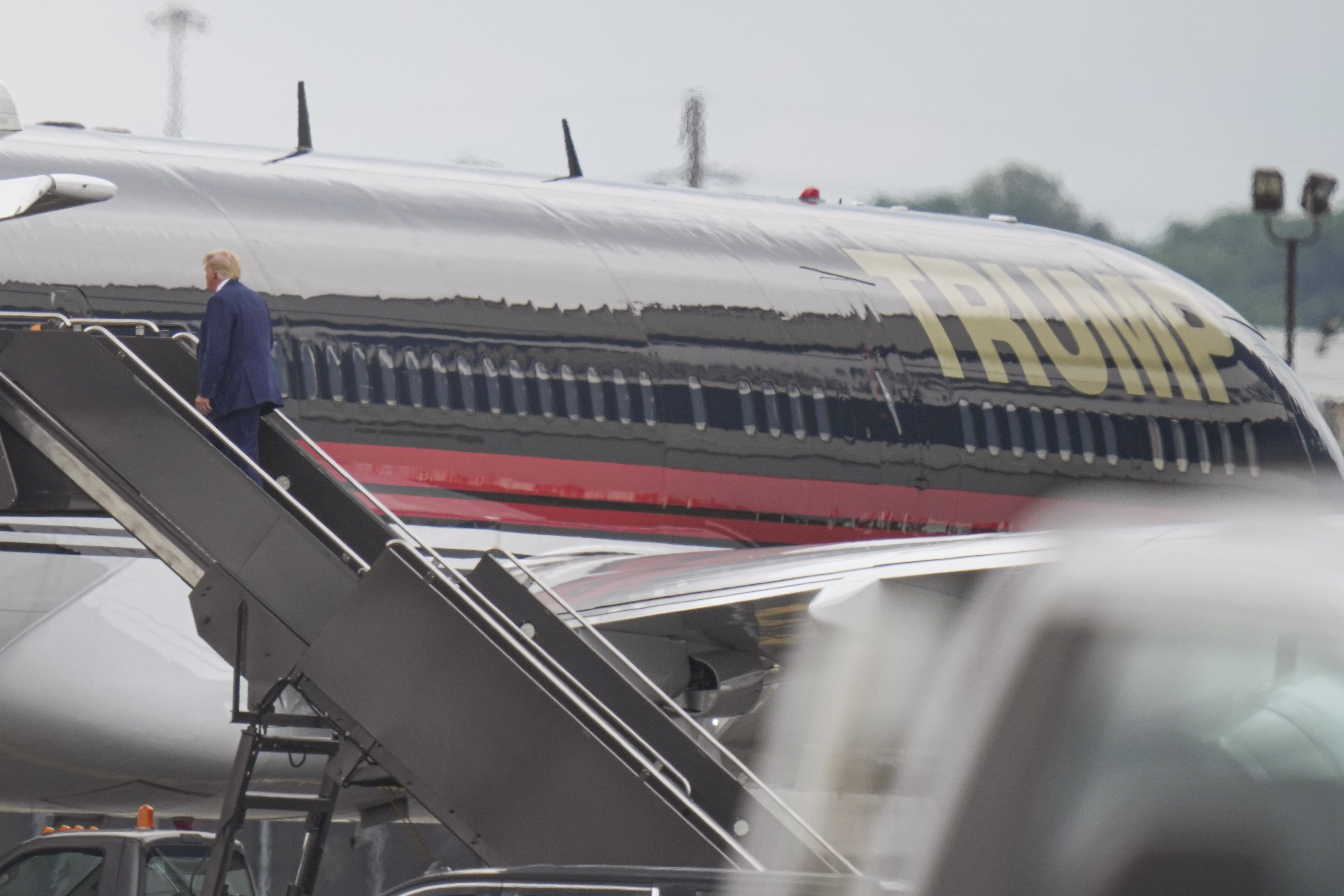 Donald Trump boarding his plane at Newark Liberty International Airport, headed to appear in a federal courthouse on charges of trying to block the peaceful transfer of power. Photo / Seth Wenig, AP