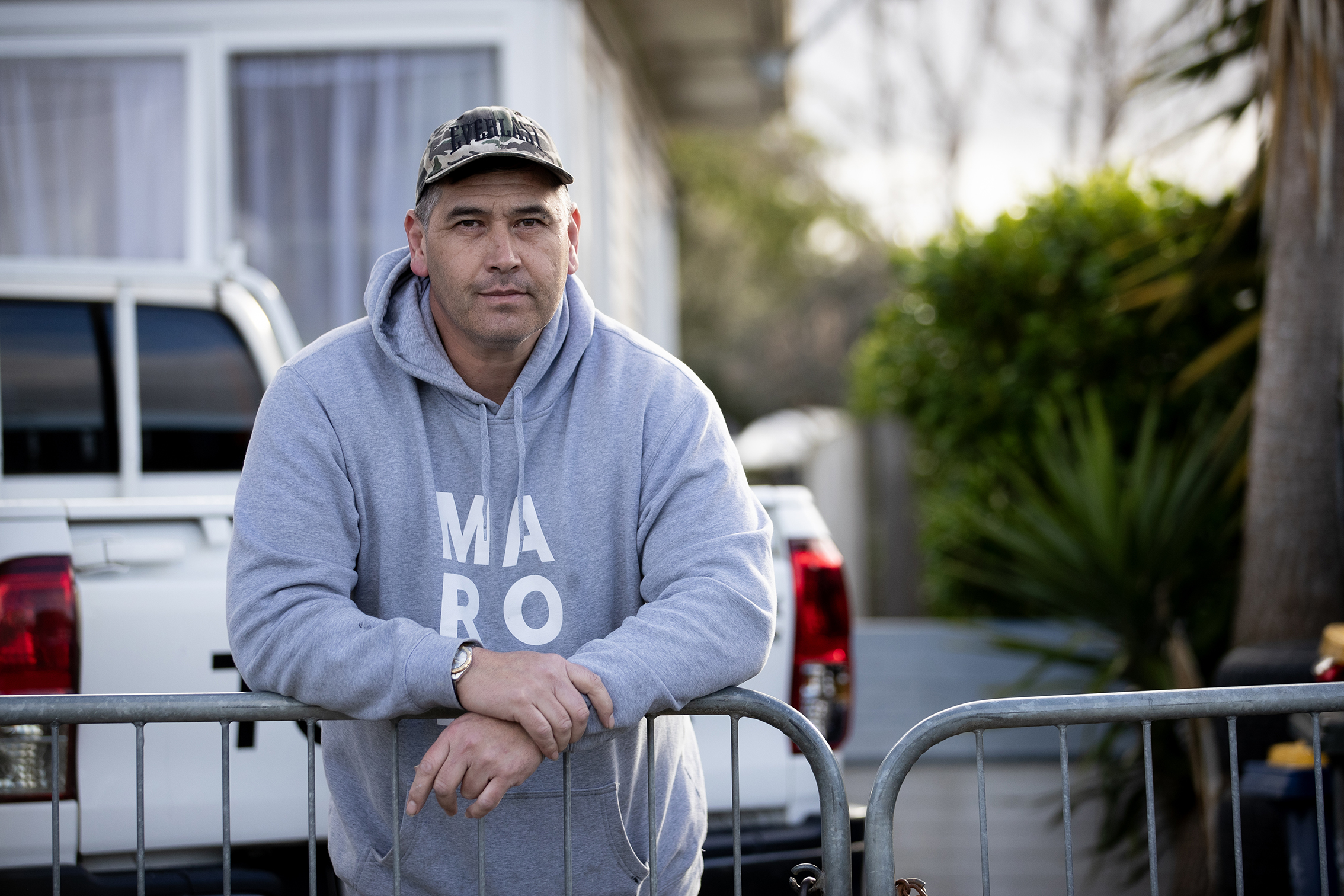 William Macneil outside his Beach Haven home, where a Kāinga Ora neighbour allegedly lunged at him with a butcher's knife then threatened to ram raid his house while he and his family were inside. Photo / Dean Purcell