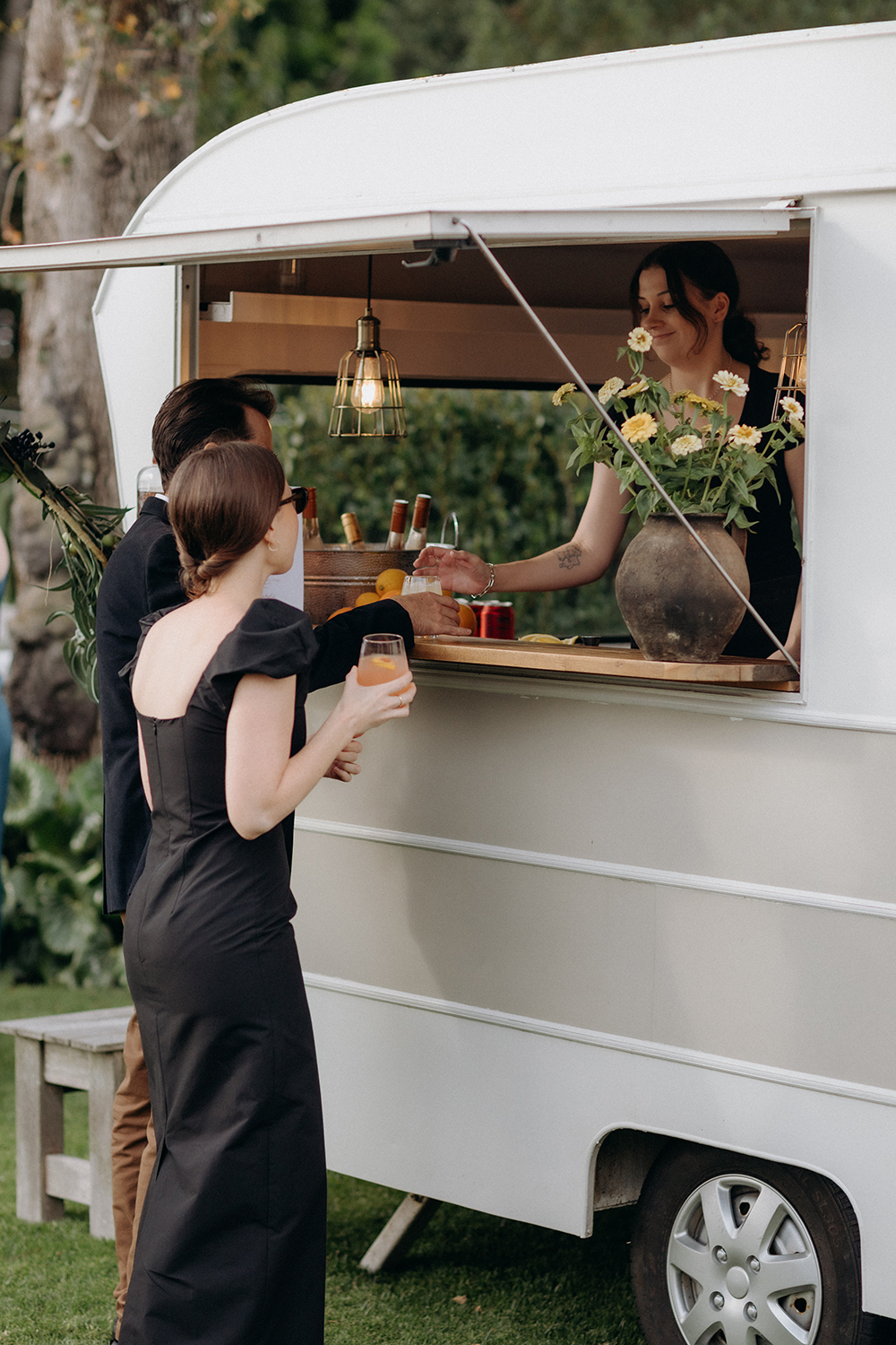 A vintage drinks caravan served Natalie and Sam's favourite cocktails along with beer, wine, Pals, and prosecco. Photo / Ana Galloway