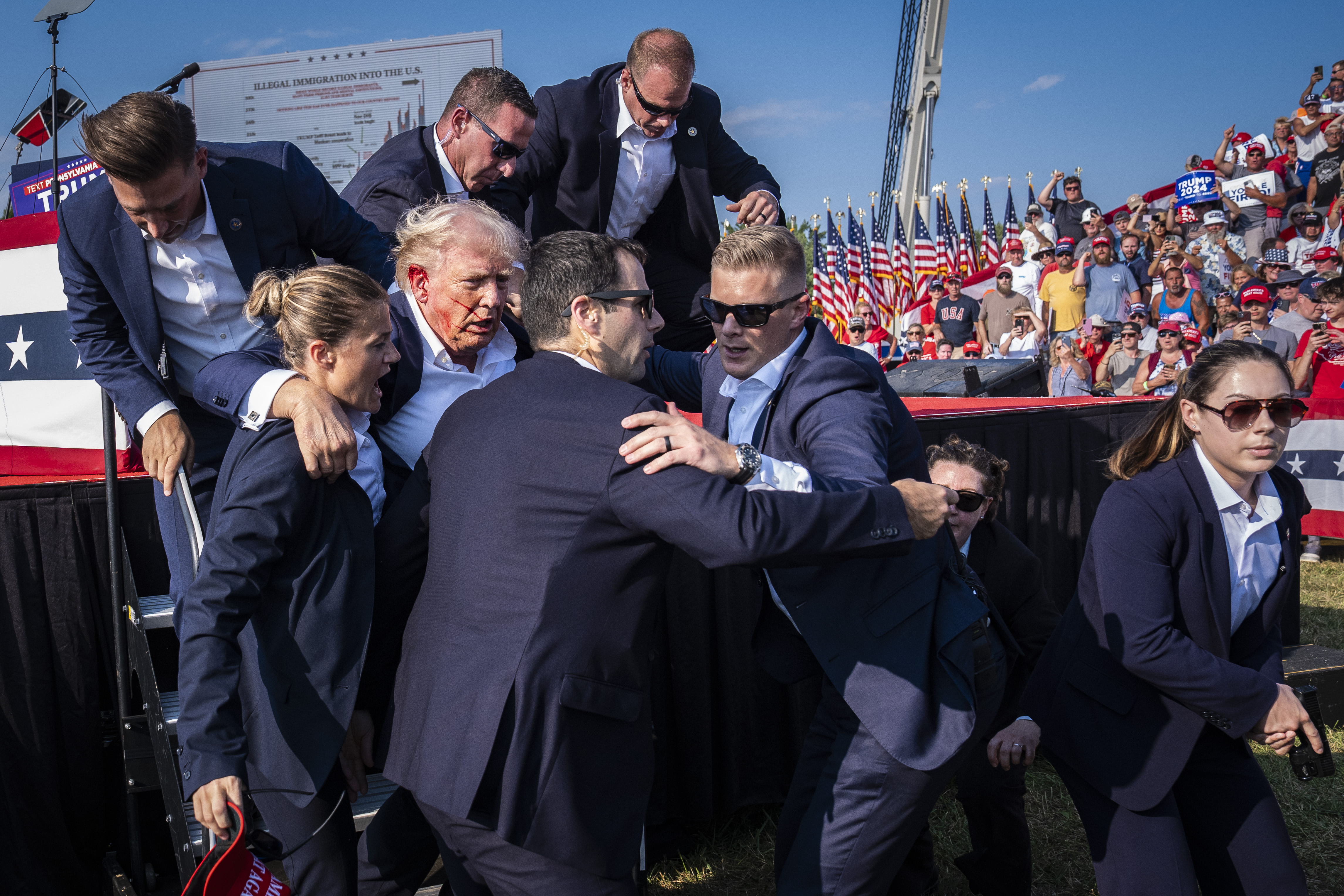 Secret Service agents remove former President Donald Trump from the stage on Saturday after an assassination attempt on him during his rally in Butler, Pennsylvania. Photo / Washington Post