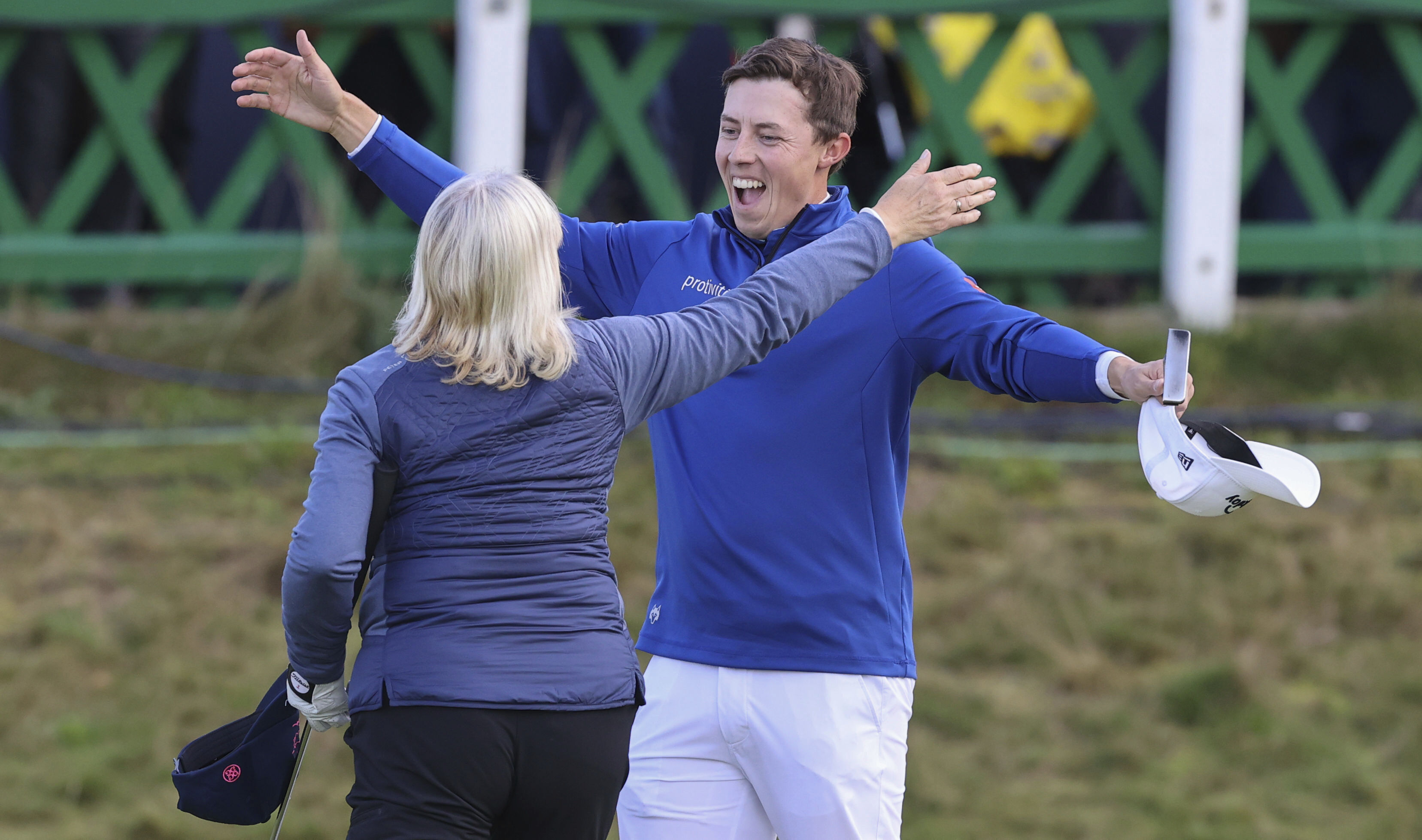 England's Matt Fitzpatrick celebrates with his mother Susan Fitzpatrick after finishing his round on the 18th green during day five of the Alfred Dunhill Links Championship at St Andrews. Photo / AP