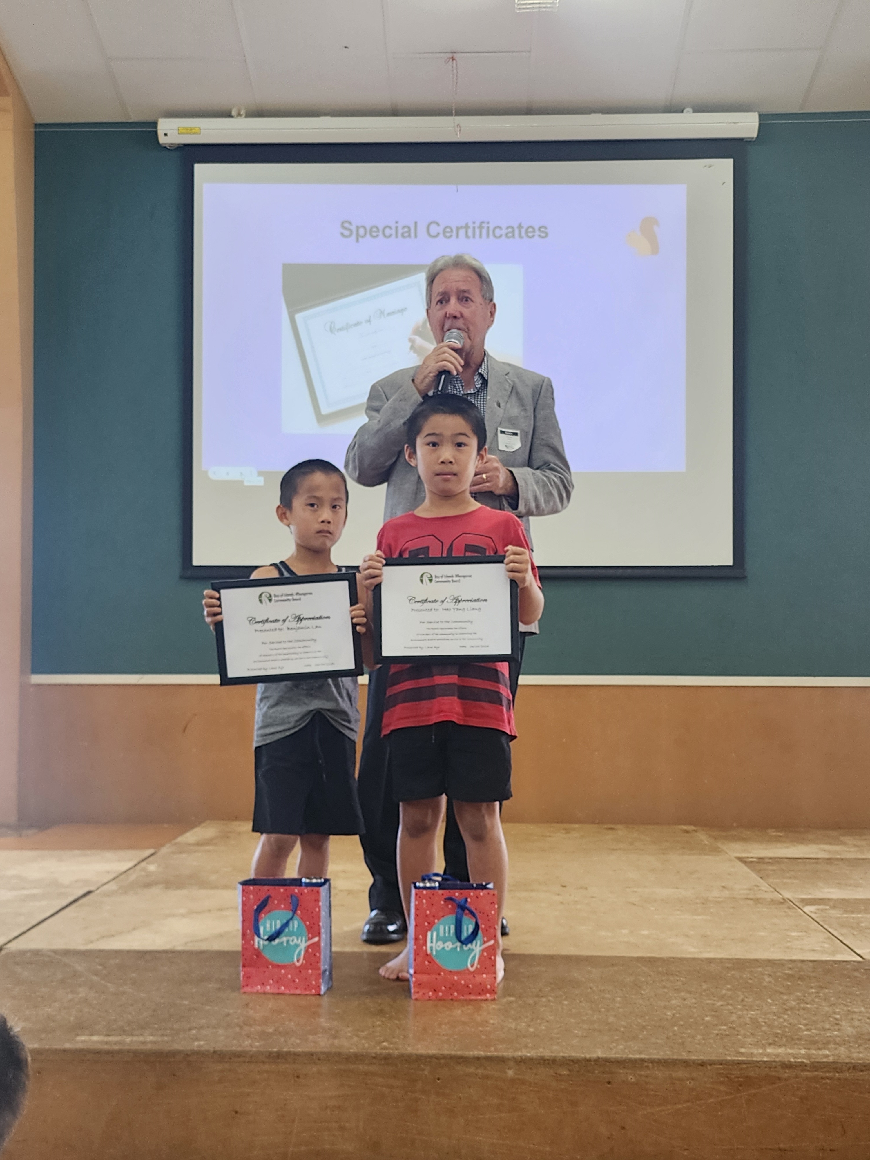 Benejamin Lan (left) and Hao Yang Liang with Bay of Islands-Whangaroa Community Board member Lane Ayr. The boys received certificates of appreciation at Riverview School assembly for picking up rubbish in the Kerikeri Domain. Photo / Supplied