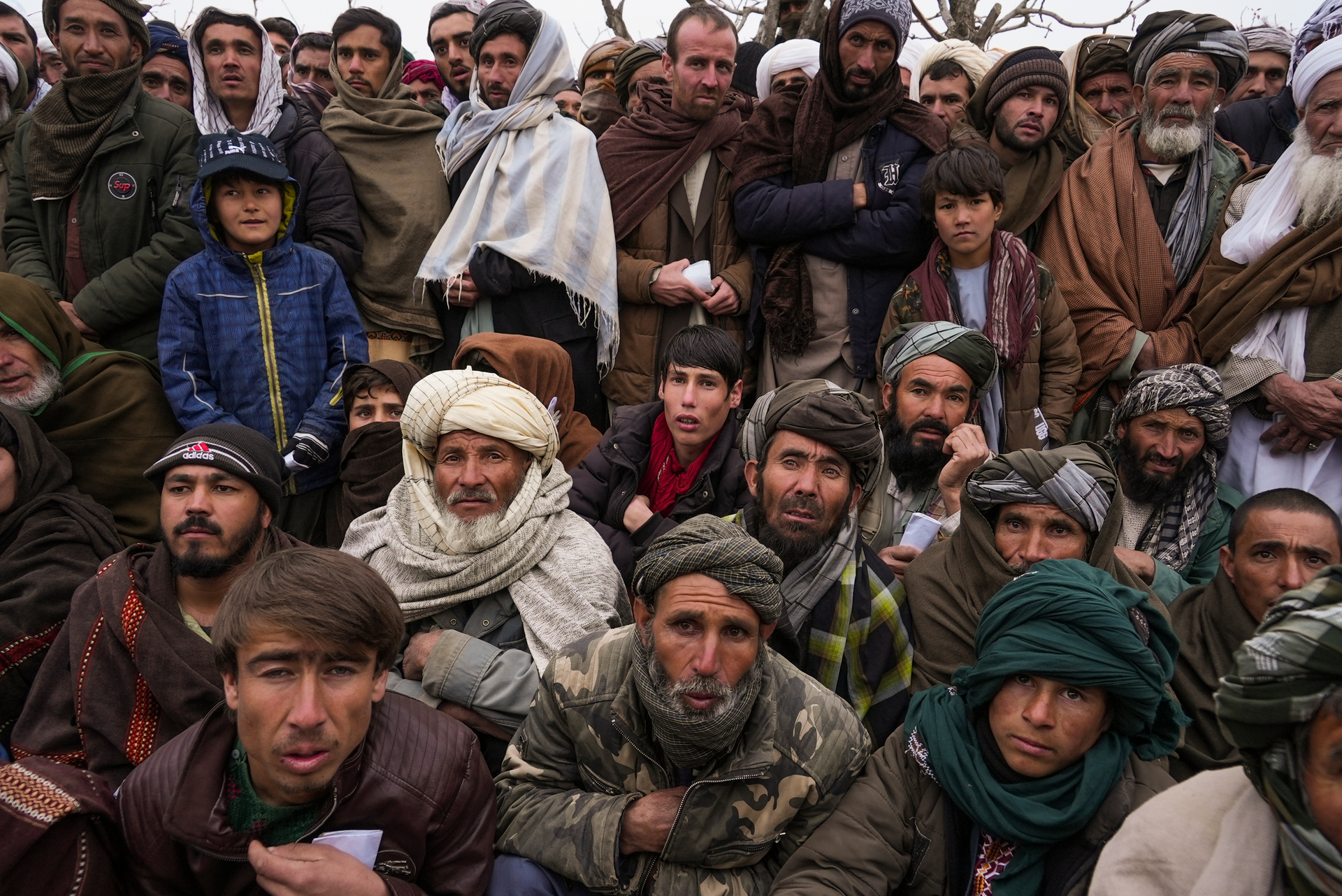 FILE - Hundreds of Afghan men gather to apply for humanitarian aid in Qala-e-Naw, Afghanistan. Photo / AP