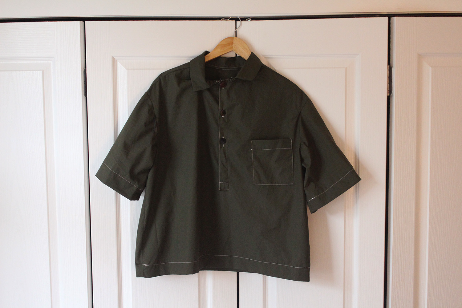 The finished Sparrow Shirt, with gathering hems, a loose placket and mismatched second-hand buttons. Photo / Madeleine Crutchley