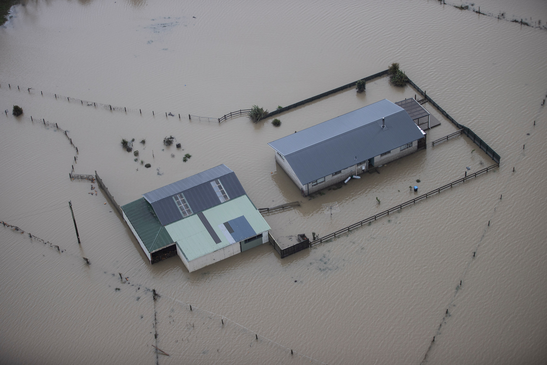 Westport was last month swamped by a deluge driven by a moisture-packed atmospheric river stretching to the tropics - the type of event growing more frequent under climate change. Photo / George Heard