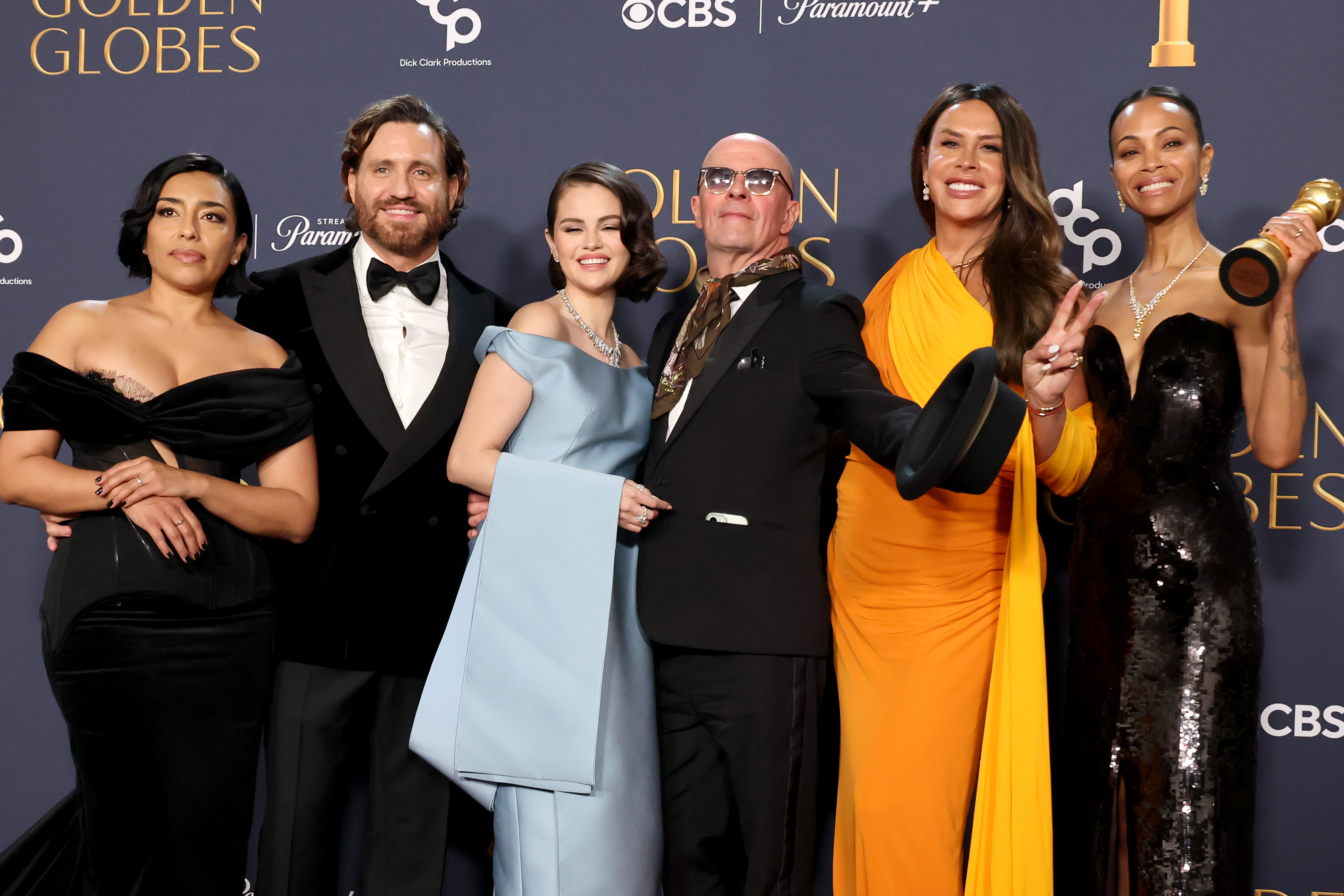(L-R) Adriana Paz, Edgar Ramírez, Selena Gomez, Jacques Audiard, Karla Sofía Gascón, and Zoe Saldana, winners of the Best Motion Picture - Musical or Comedy award for “Emilia Pérez,” pose in the press room during the 82nd Annual Golden Globe Awards. Photo / Getty Images