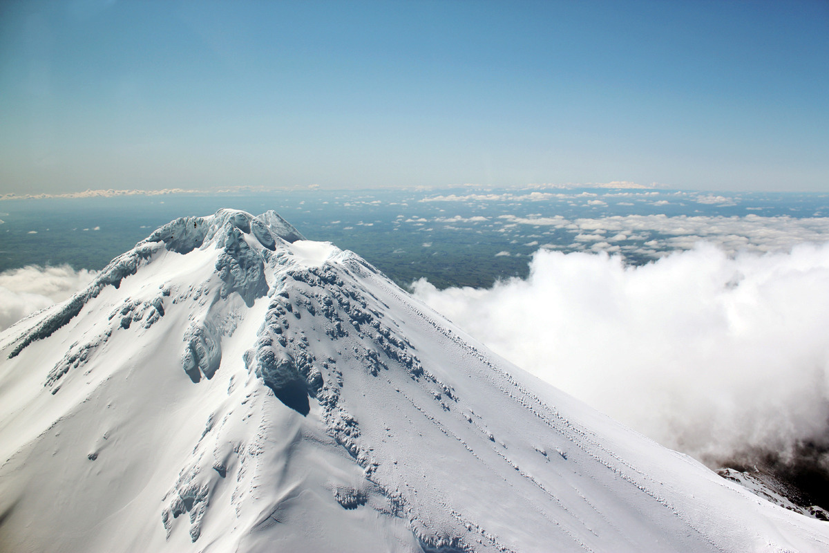 A snow-capped Mount Taranaki summit from above. Photo / Supplied.