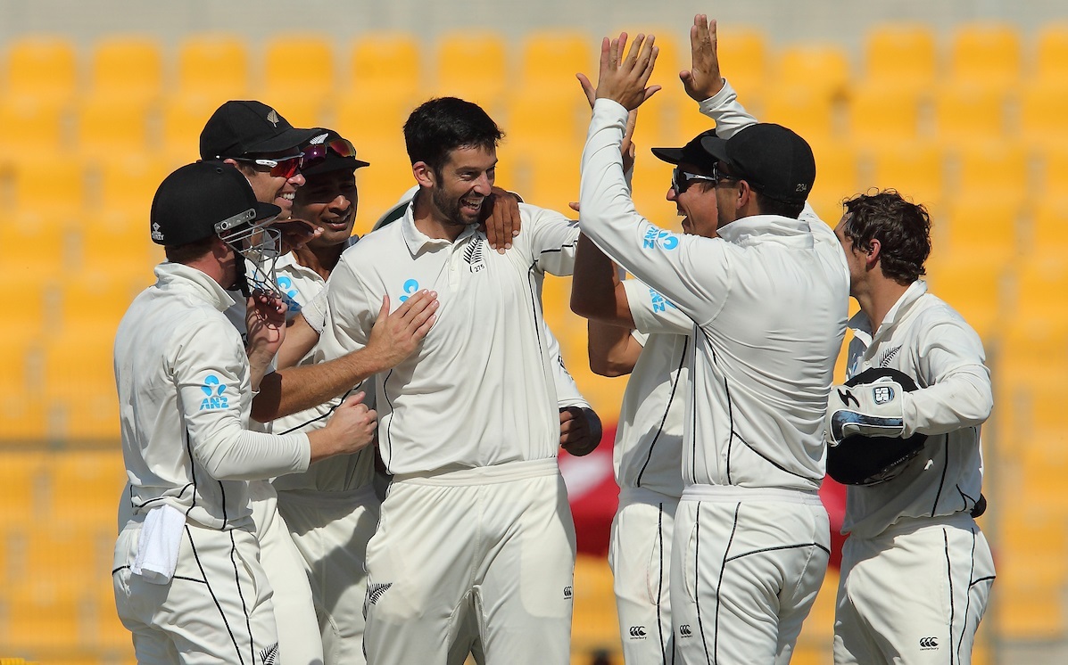 The Black Caps celebrate one of Will Somerville's three wickets. Photo / Photosport