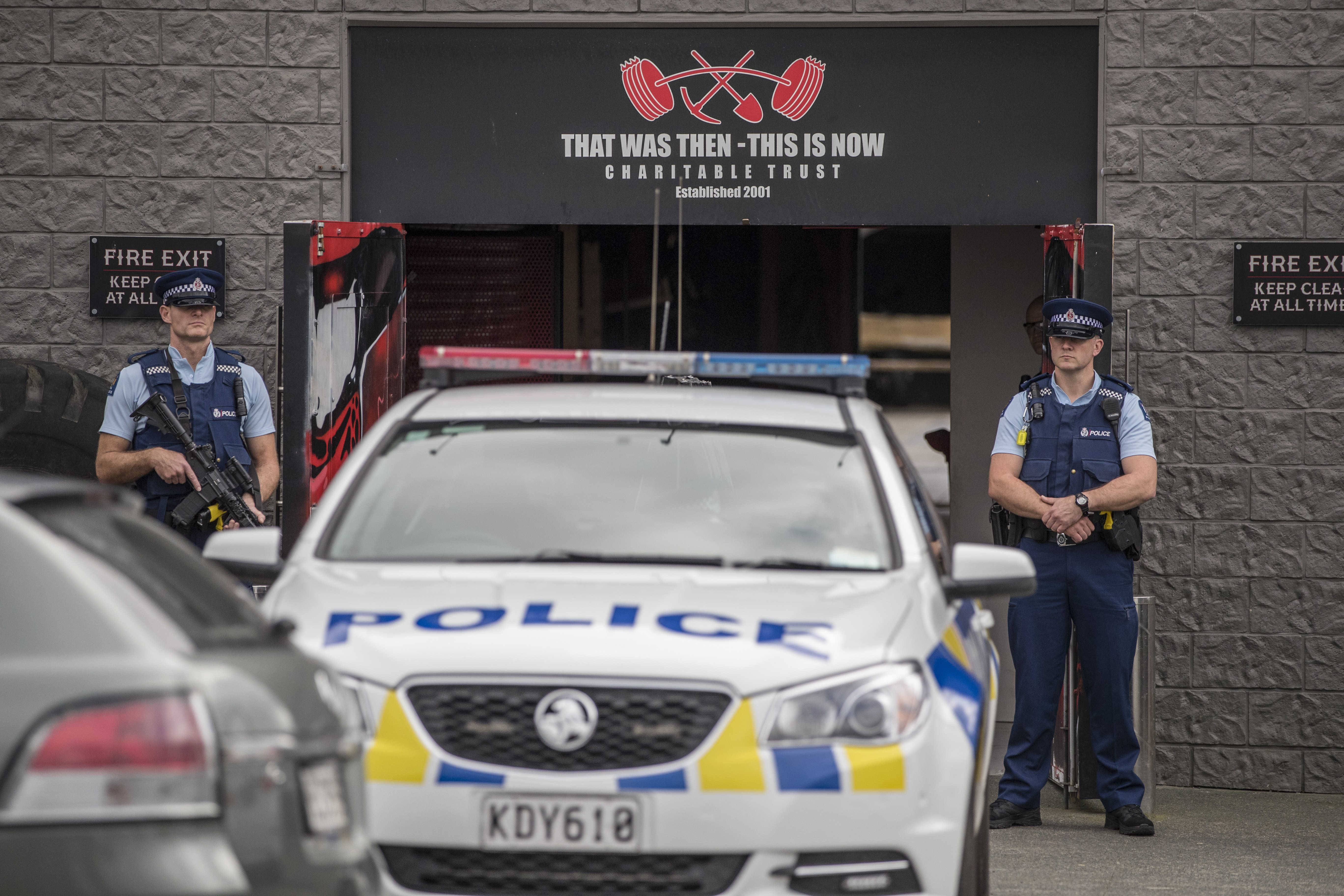 Armed police officers stand guard at the Head Hunters pad, also the office of the gang's charitable trust. Photo/NZ Herald.