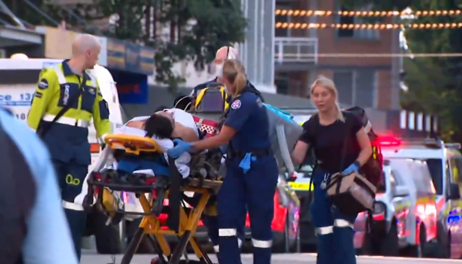 An injured person taken from the scene of the Bondi Junction stabbing attack. Photo / 9News