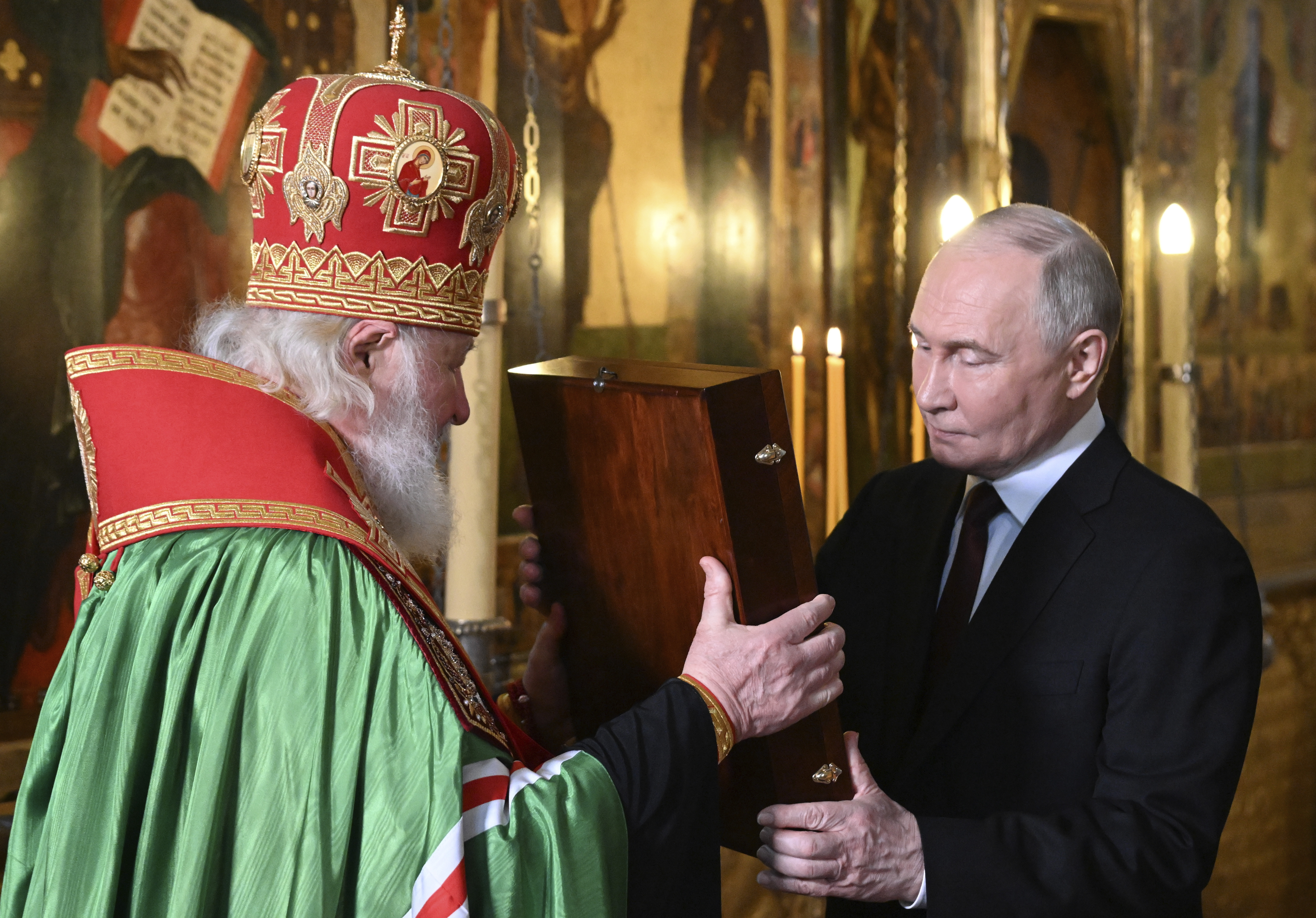 Russian President Vladimir Putin, right, and Patriarch Kirill of Moscow at a prayer service at the Annunciation Cathedral in Moscow, Russia. Photo / AP