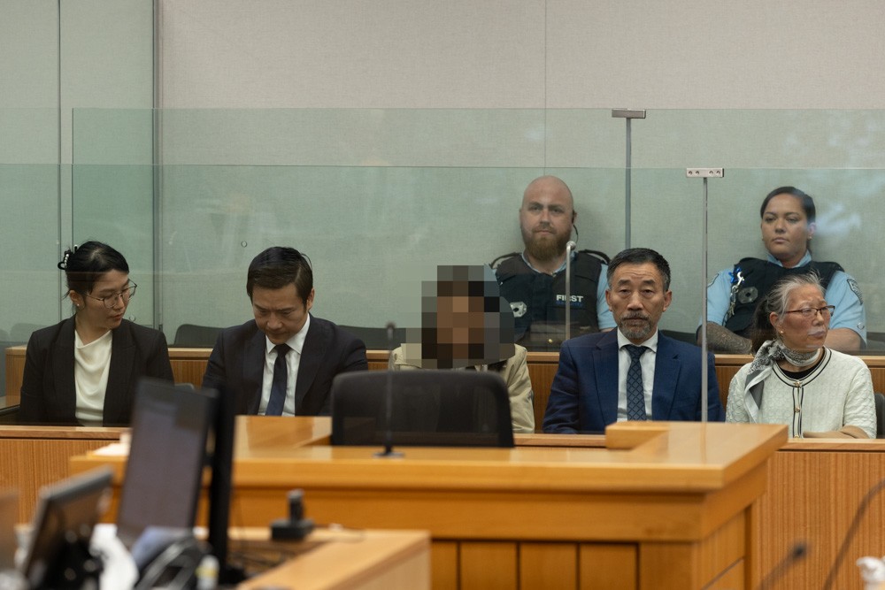 The kidnapping and manslaughter trial of alleged sect leader Kaixiao Liu and his wife (Lanyue Xiao) and parents (Xiuyun Li and Jingui Liu). An interpreter is seated in the middle. Photo / Jason Dorday