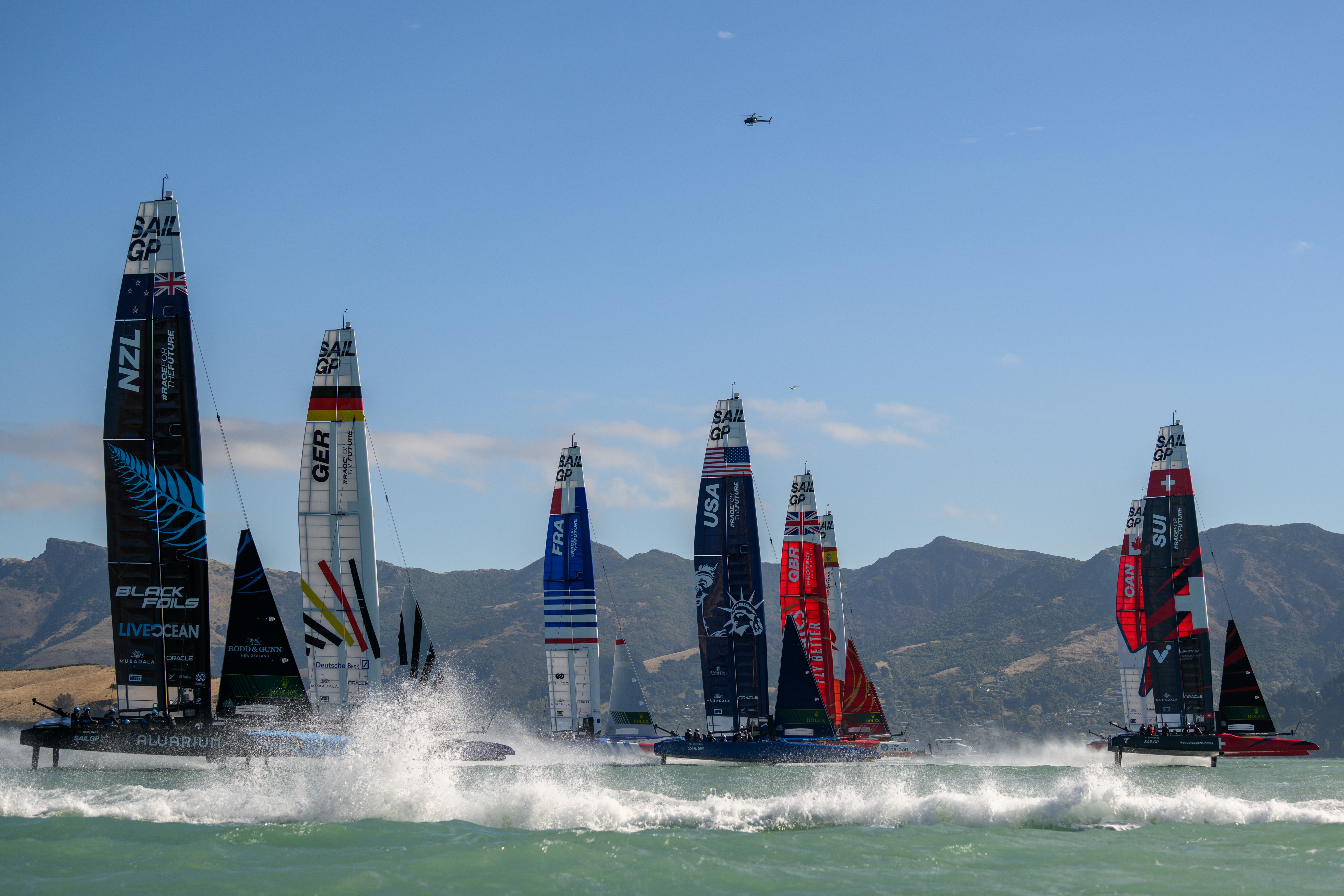 From left: Teams New Zealand, Germany, France, USA, Great Britain, Spain, Canada and Switzerland race during SailGP. Photo / Getty Images
