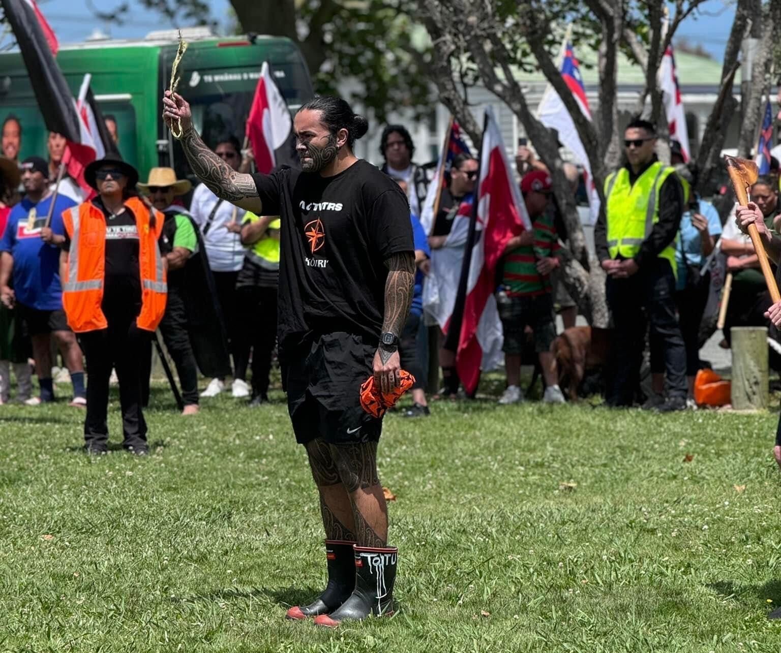 Eru Kapa-Kingi picks up the wero in Dargaville as part of the hīkoi process.