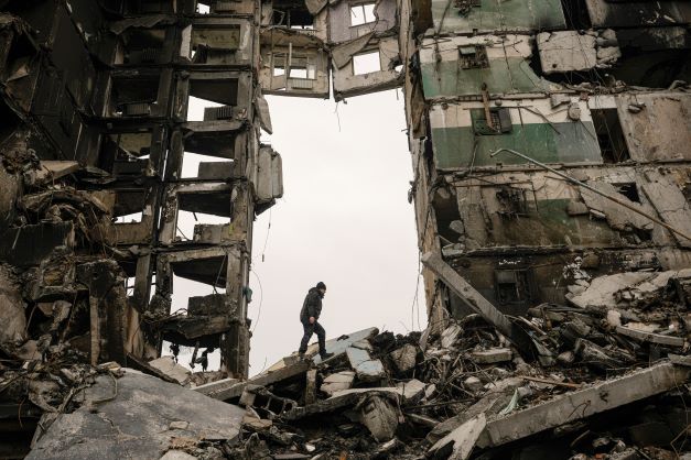 A resident looks for belongings in an apartment building destroyed during fighting between Ukrainian and Russian forces in Borodyanka, Ukraine, in April 2022. Photo / AP