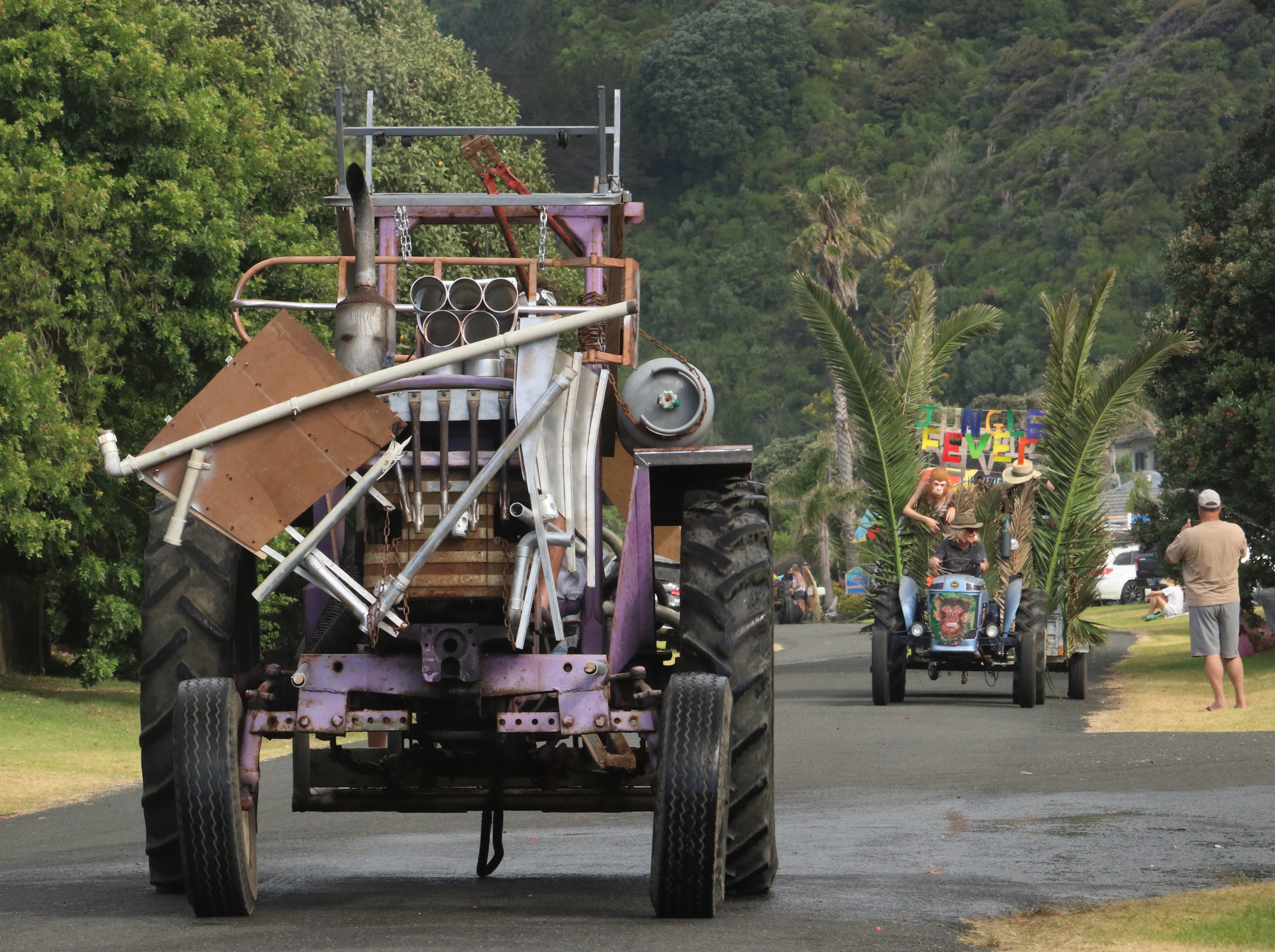 Mad Max’s War Rig trundles down Taupō Bay’s main drag after suffering a front armour malfunction. Photo / Peter de Graaf
