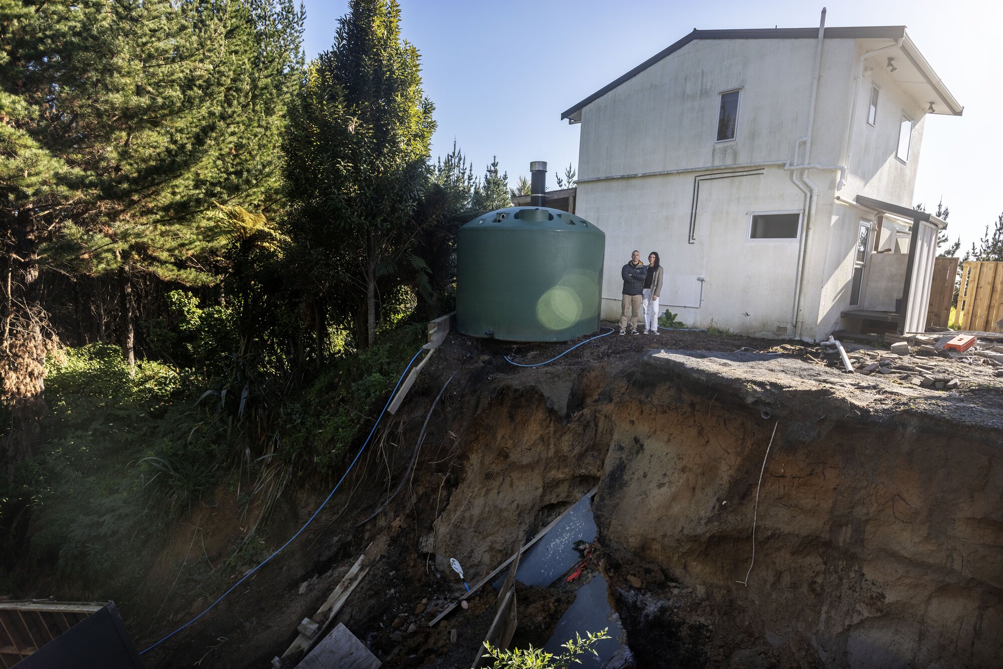In the early hours of January 22, the family fled their landslide-threatened home, navigating numerous slips on Reid Rd before reaching safety. Photo / Mike Scott