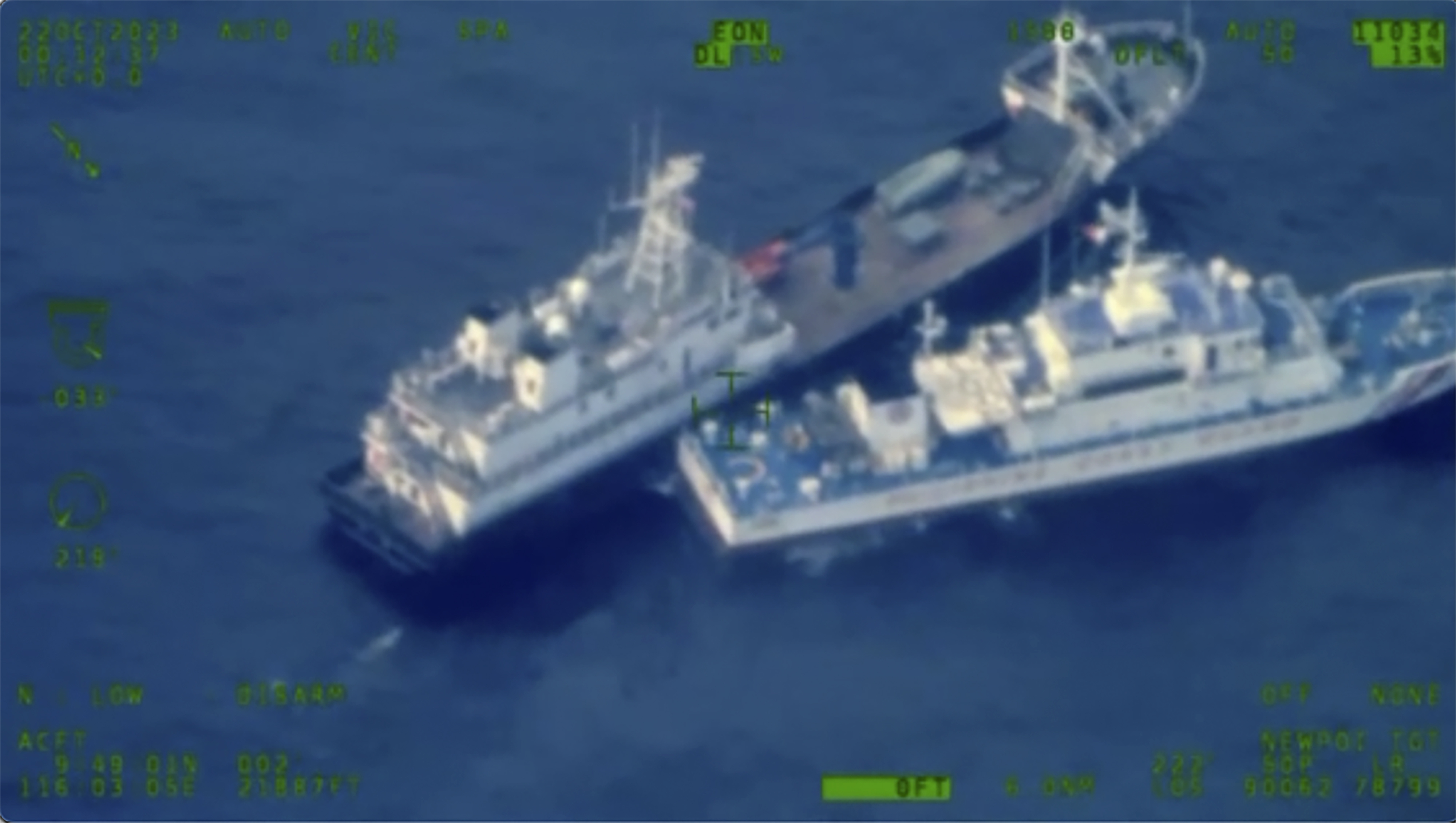 A Chinese militia boat, top, and Philippine coast guard boat come together off Second Thomas Shoal on Sunday. Photo / AP