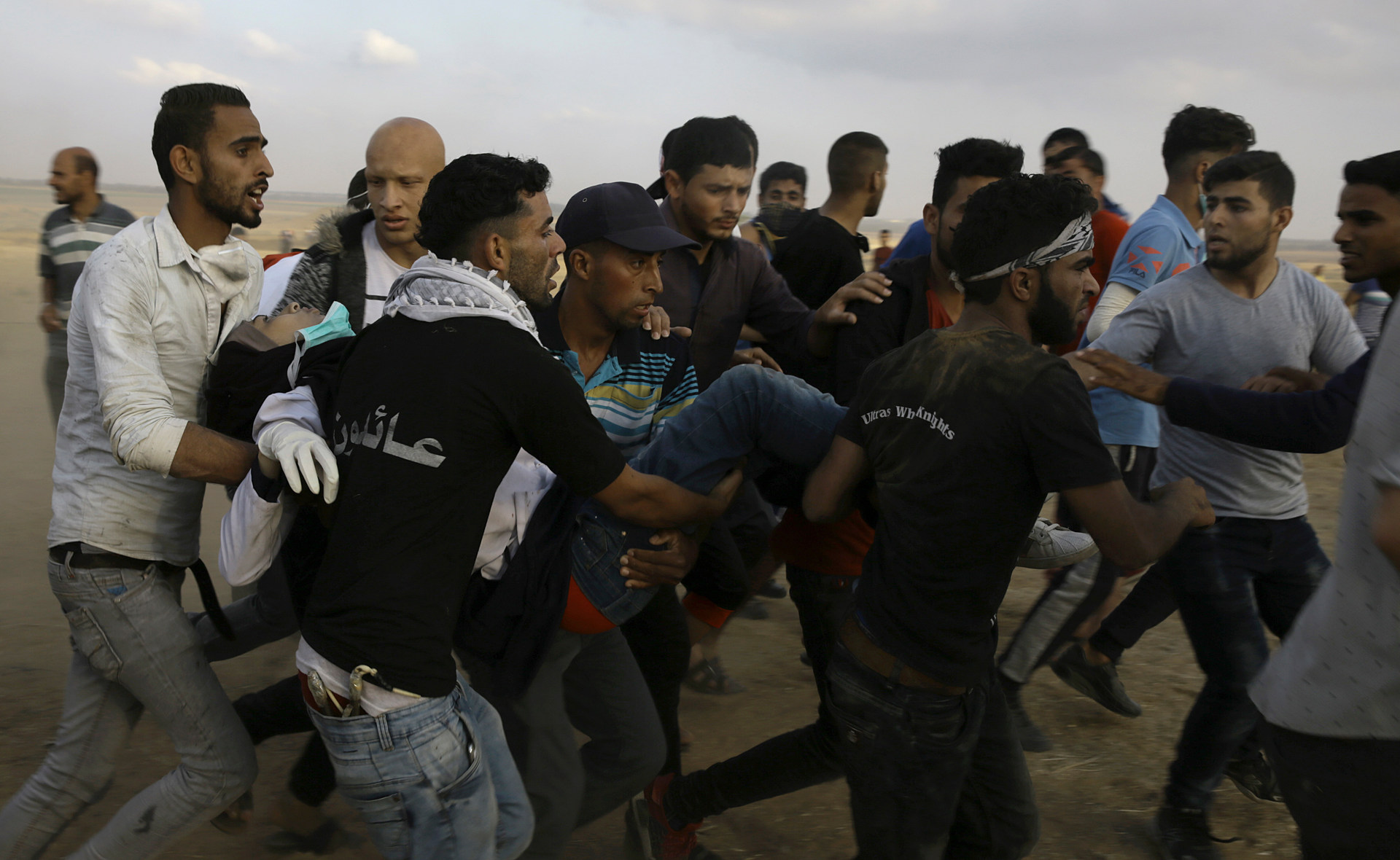 Palestinian protesters evacuate Razan Najjar, 21,  near the Gaza Strip's border with Israel. Najjar was to die from the gunshot. Photo / AP