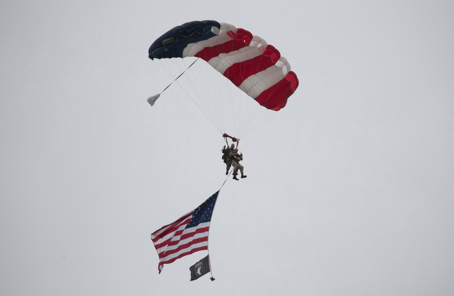 US World War II D-Day veteran Tom Rice, from Coronado, California, parachutes in a tandem jump into a field in Carentan, Normandy, France. Photos / AP