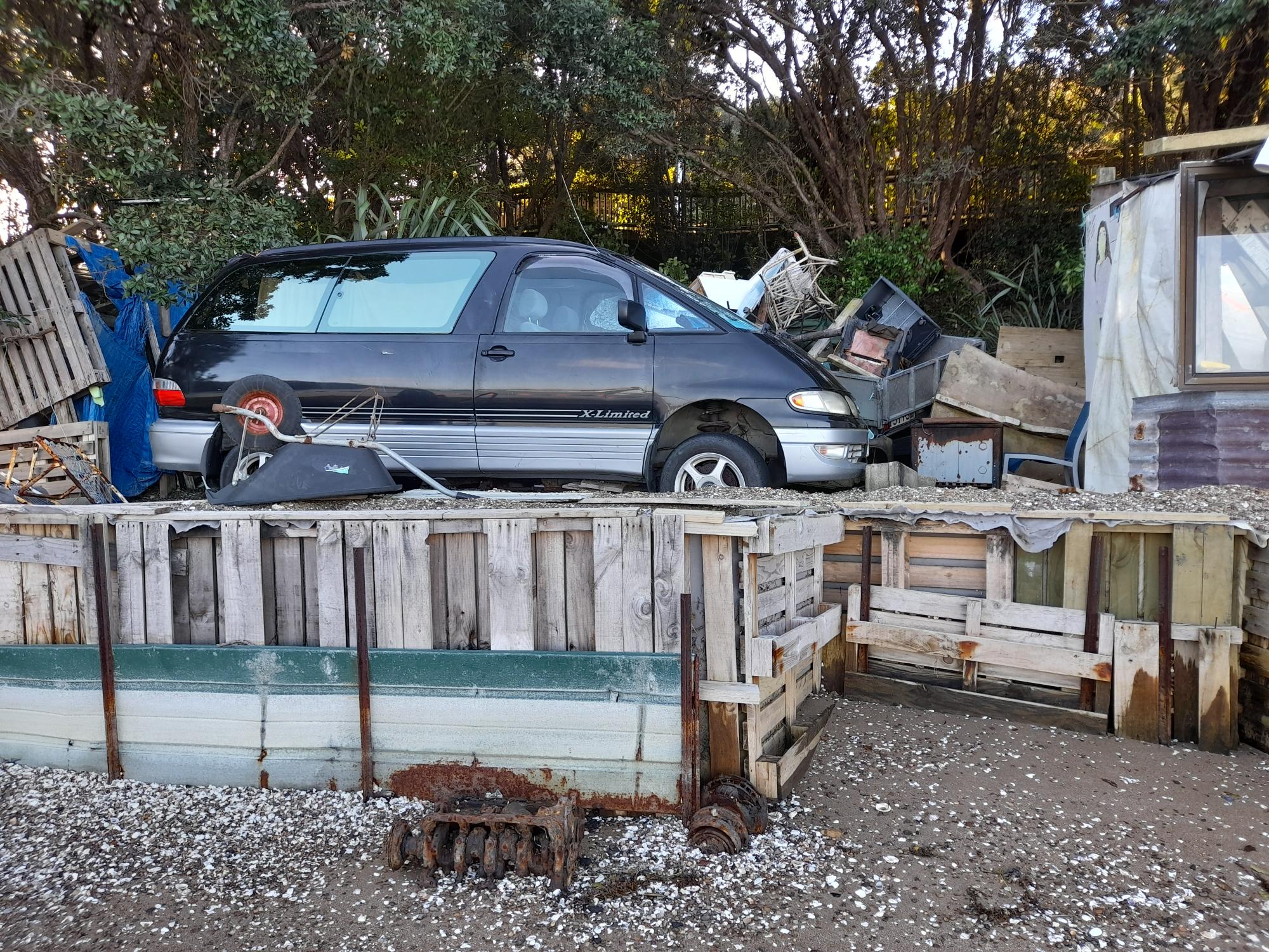Parking between two illegal structures on the beach at Waiheke Island opposite the new 181-berth marina.