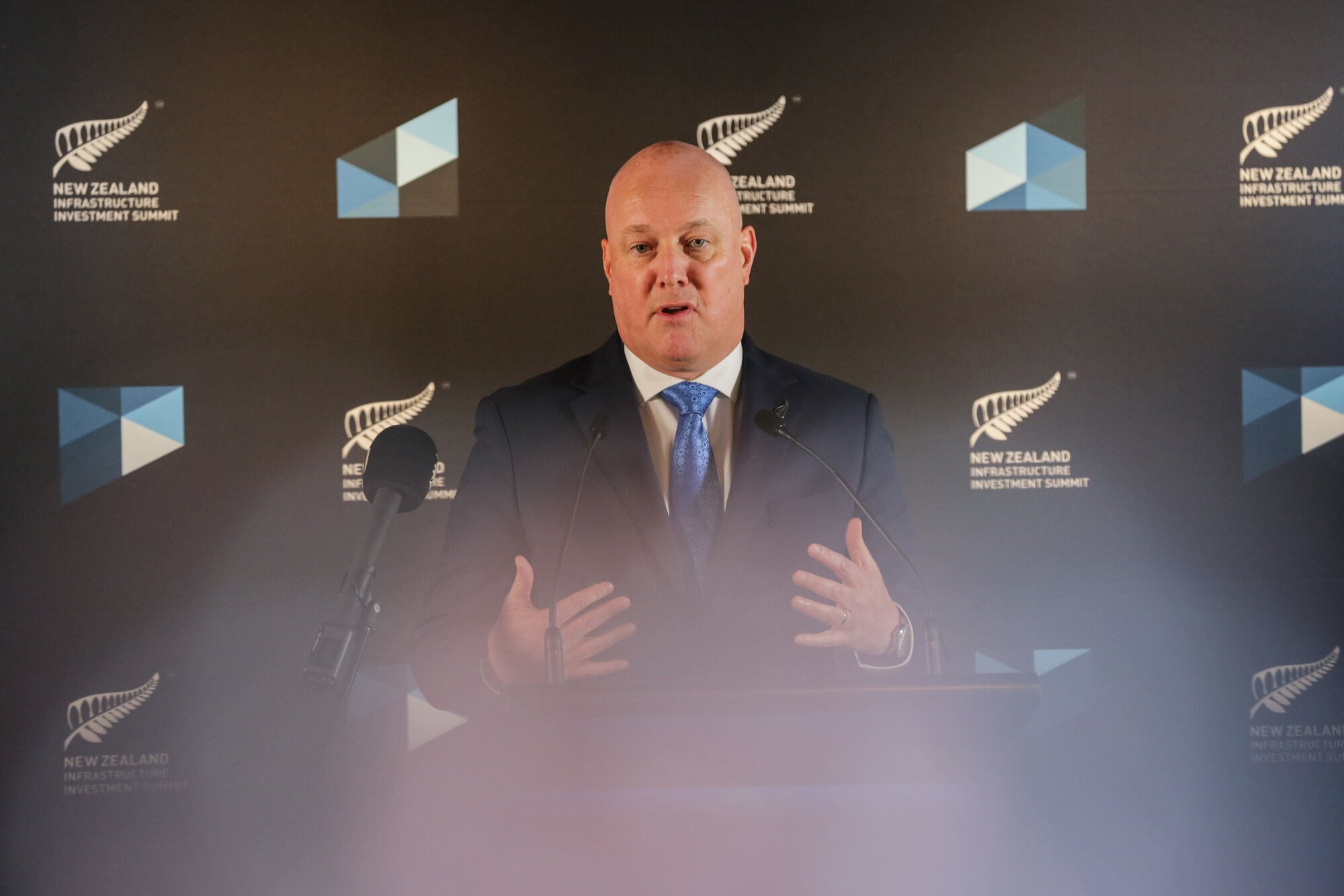 Prime Minister Christopher Luxon speaks to media after the first day of the Infrastructure Investment Summit at the Hyatt Hotel in central Auckland. Photo / Sylvie Whinray