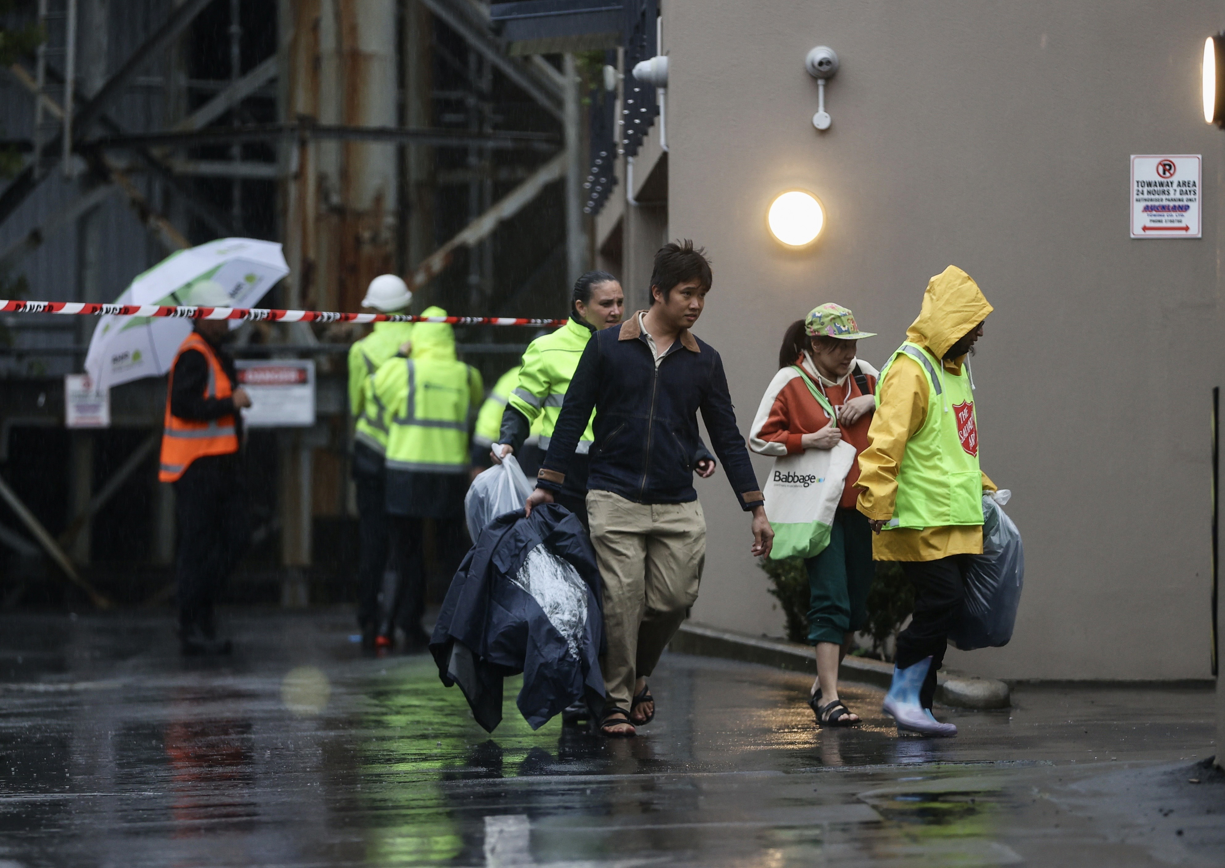 Residents evacuated from their homes on Normanby Rd, Mt Eden, after the historic Shot Tower was under threat of collapse as cyclone Gabrielle brought extreme weather to Auckland. Photo / George Heard