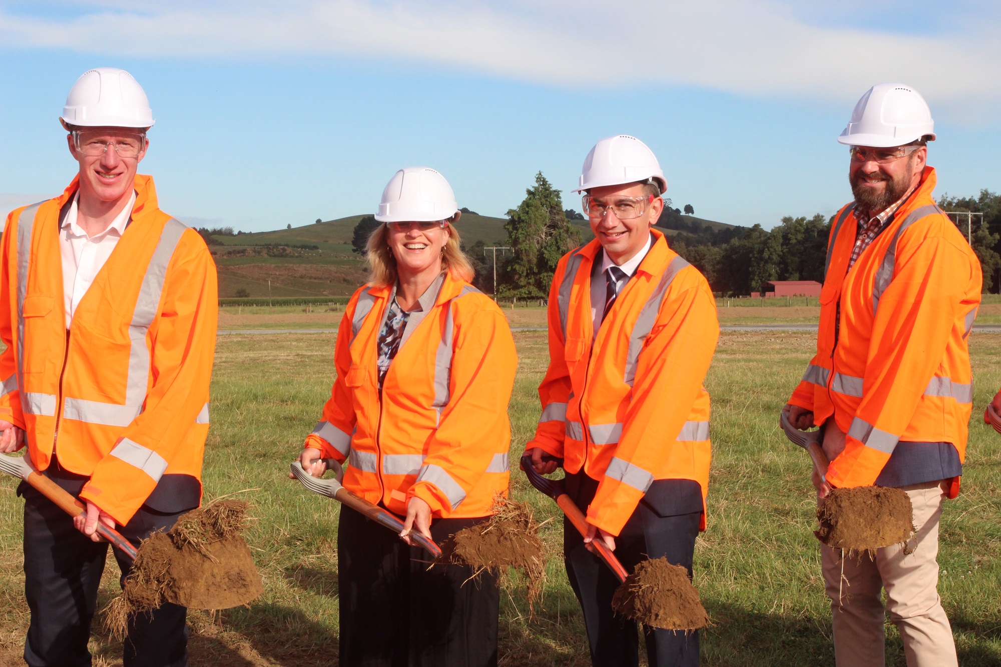 MP's Sam Uffindel, Louise Upston, Transport Minister Simeon Brown, and Waikato MP Tim van de Molen, stand at the centre of where the new roudnabout will be. Photo / Malisha Kumar