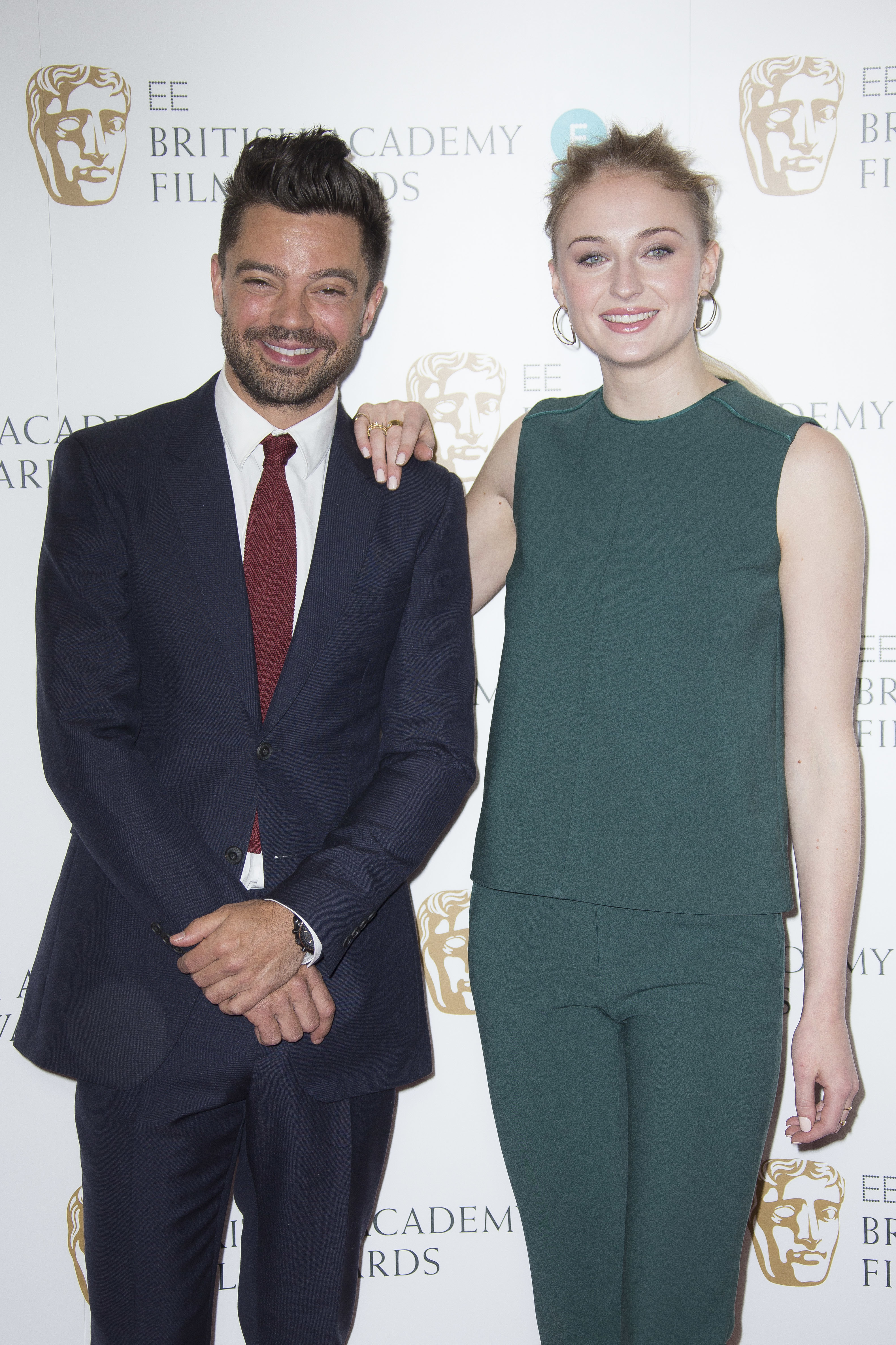 Actors Sophie Turner, right, and Dominic Cooper pose for photographers after announcing the nominations for the EE British Academy Film Awards in 2017. Photo/AP