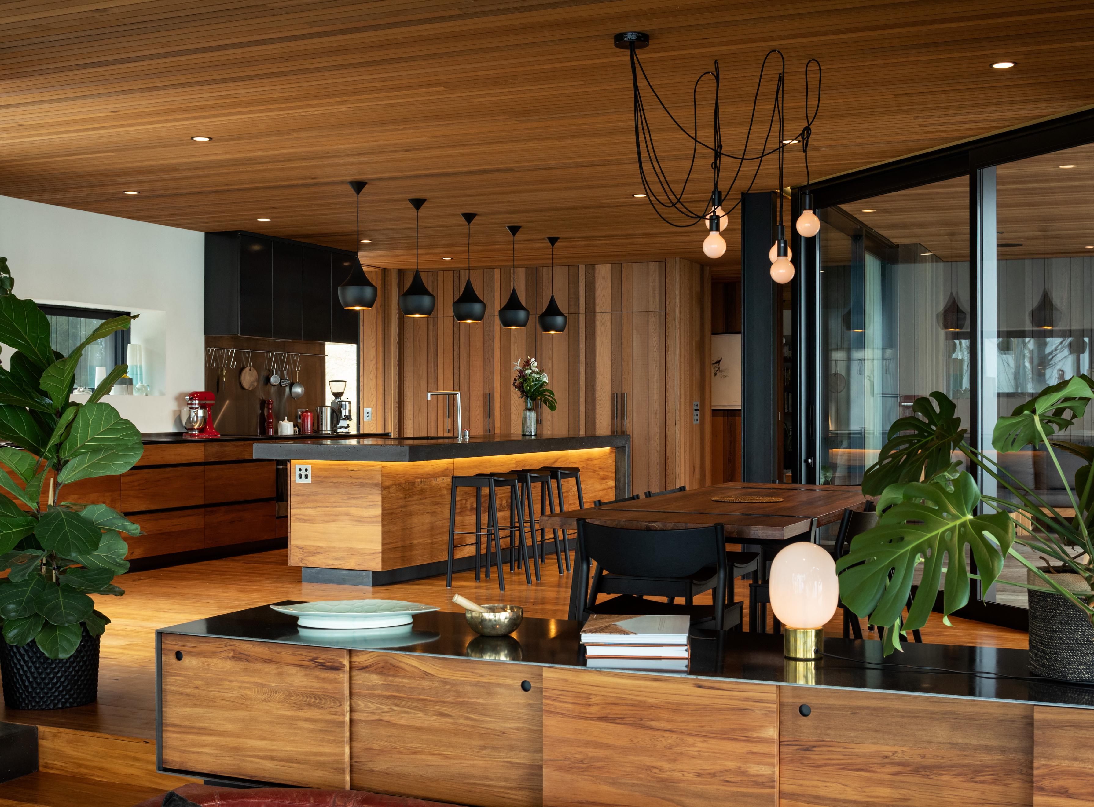 Oiled cedar, recycled rimu, concrete and black steel make for a muted and earthy interior. Photo / Simon Devitt