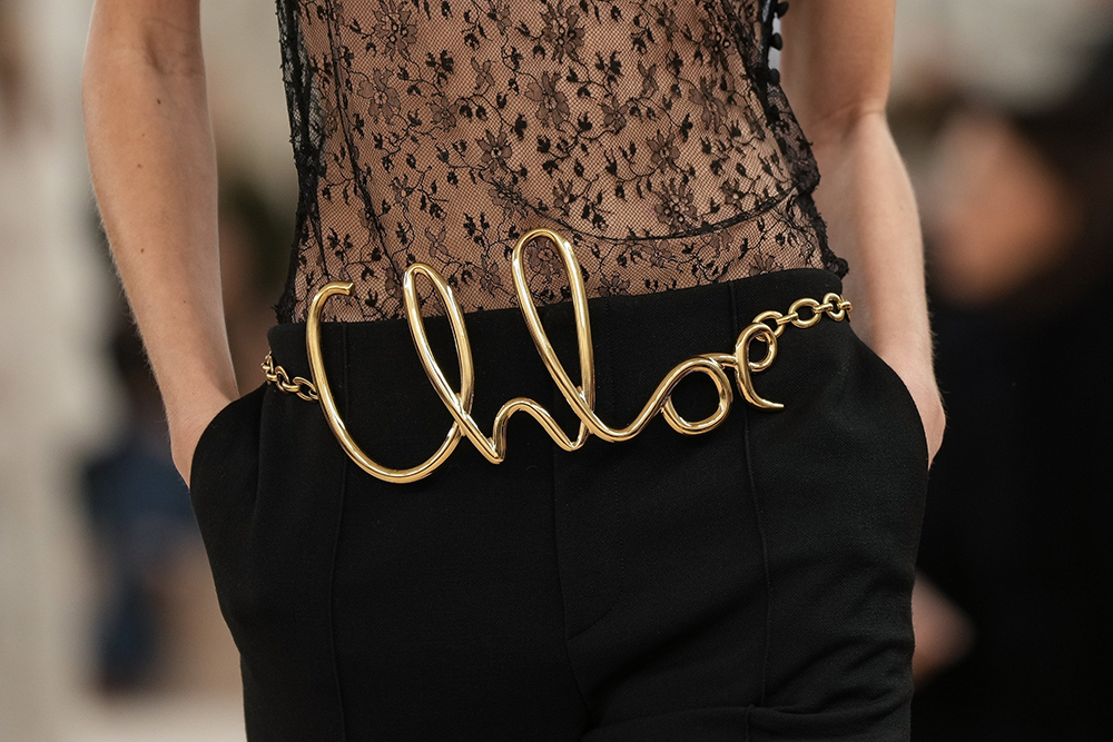 Belts in fancy script wrote out the brand’s name in gold. Photo / AP