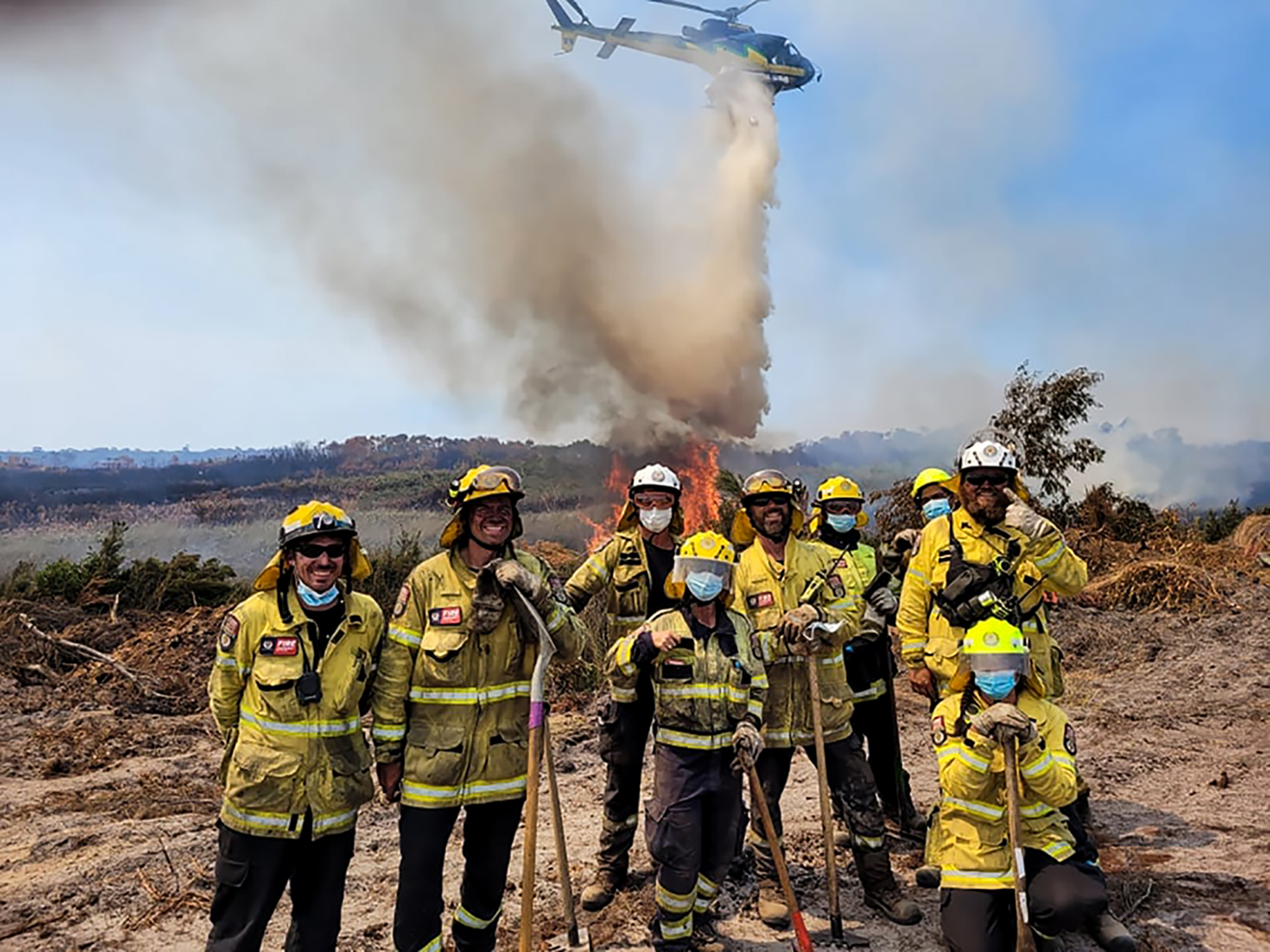 A fire-fighting crew take a break during their work extinguishing a bush fire at Waiharara in January 2022 - a job that cost $10 million. A prohibited fire ban has been imposed in the Far Far North as Fenz hopes to avoid similar fires this summer.