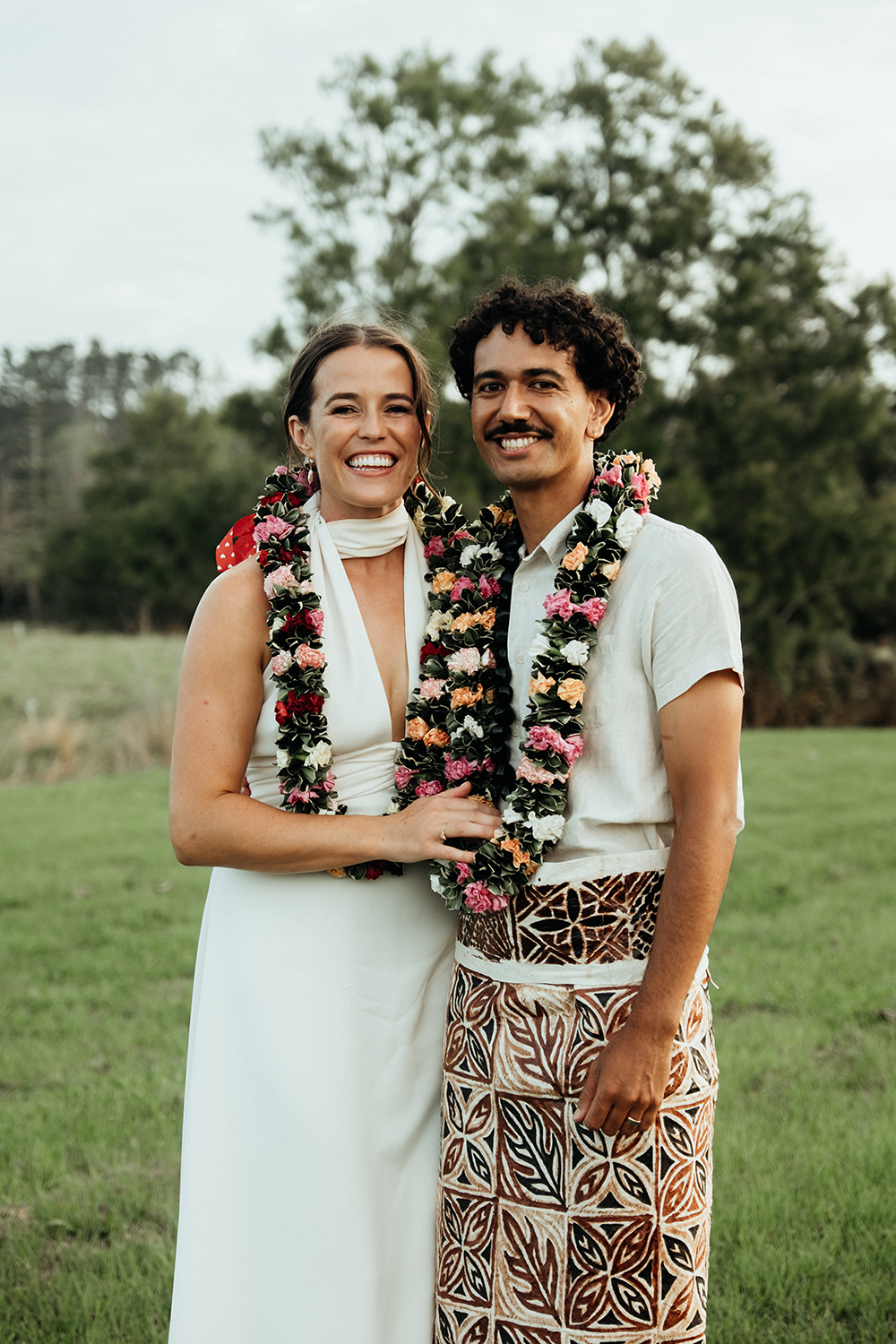 Hayley and Connor were adorned with lei. Photo / Geoffery Matautia and Hele Ikimotu.