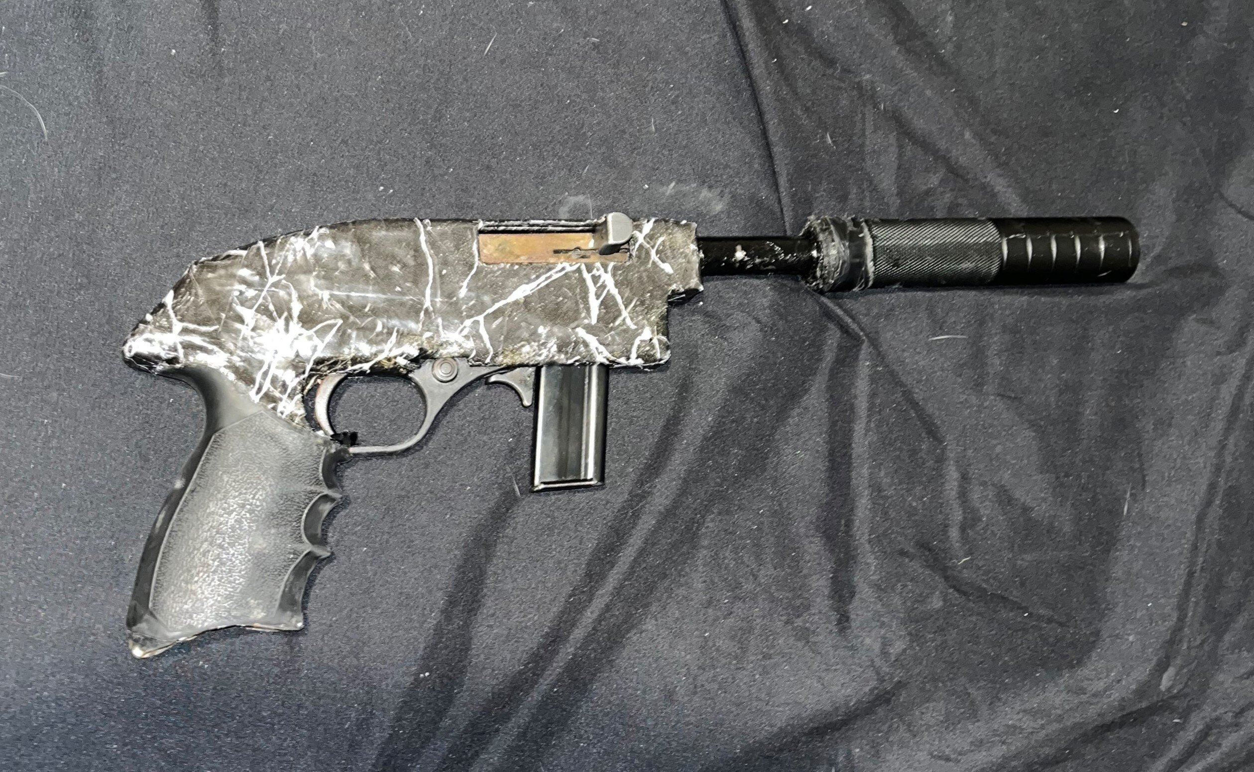 Police have seized a stash of guns, ammunition, cash and illicit drugs in raid in Central Auckland this morning, with two people facing charges. Photo / NZ Police