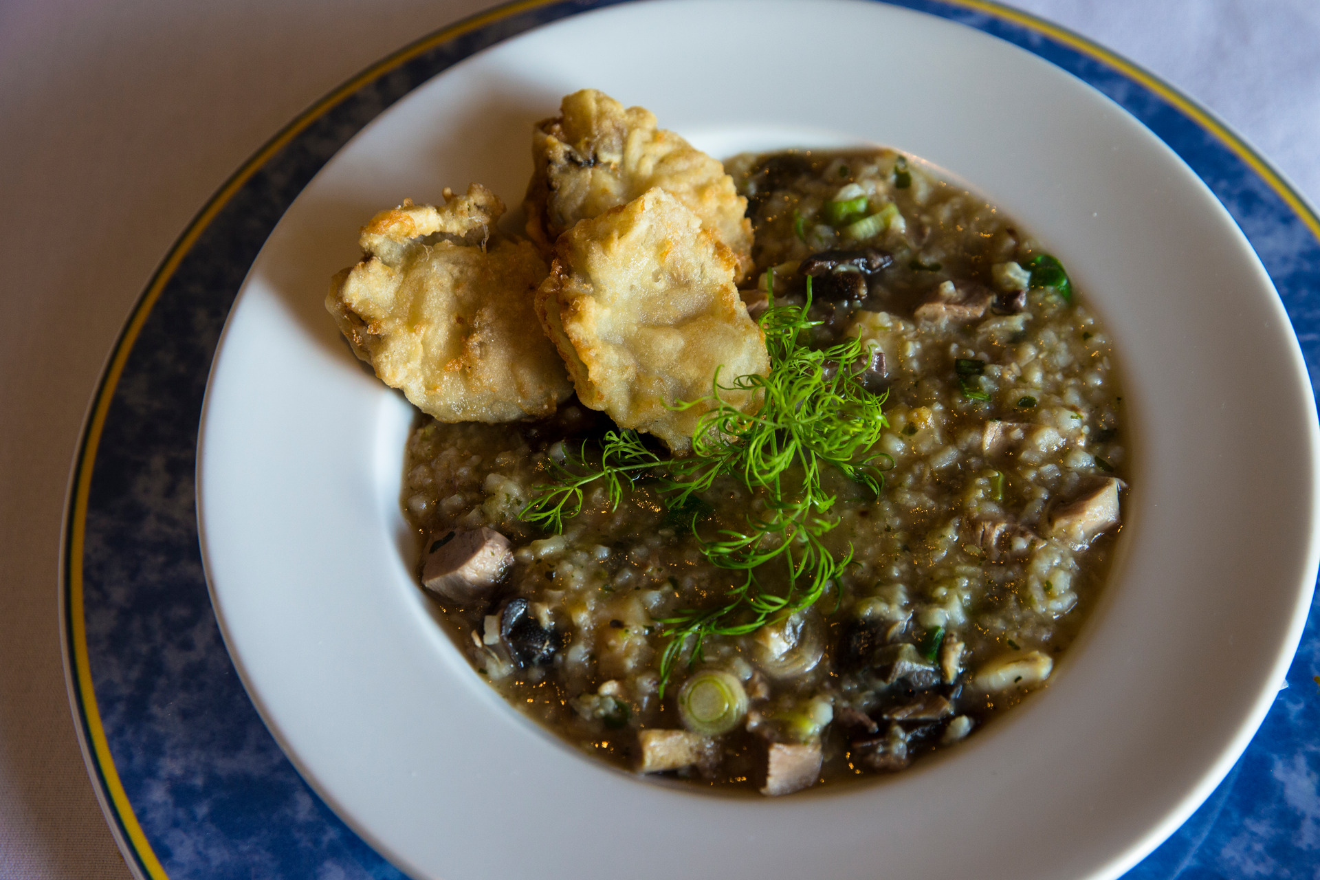 In 2015, diners at Parnell's Antoine's Restaurant ate pig's trotter, pāua and snail congee with tempura oysters. Photo/Guy Coombes