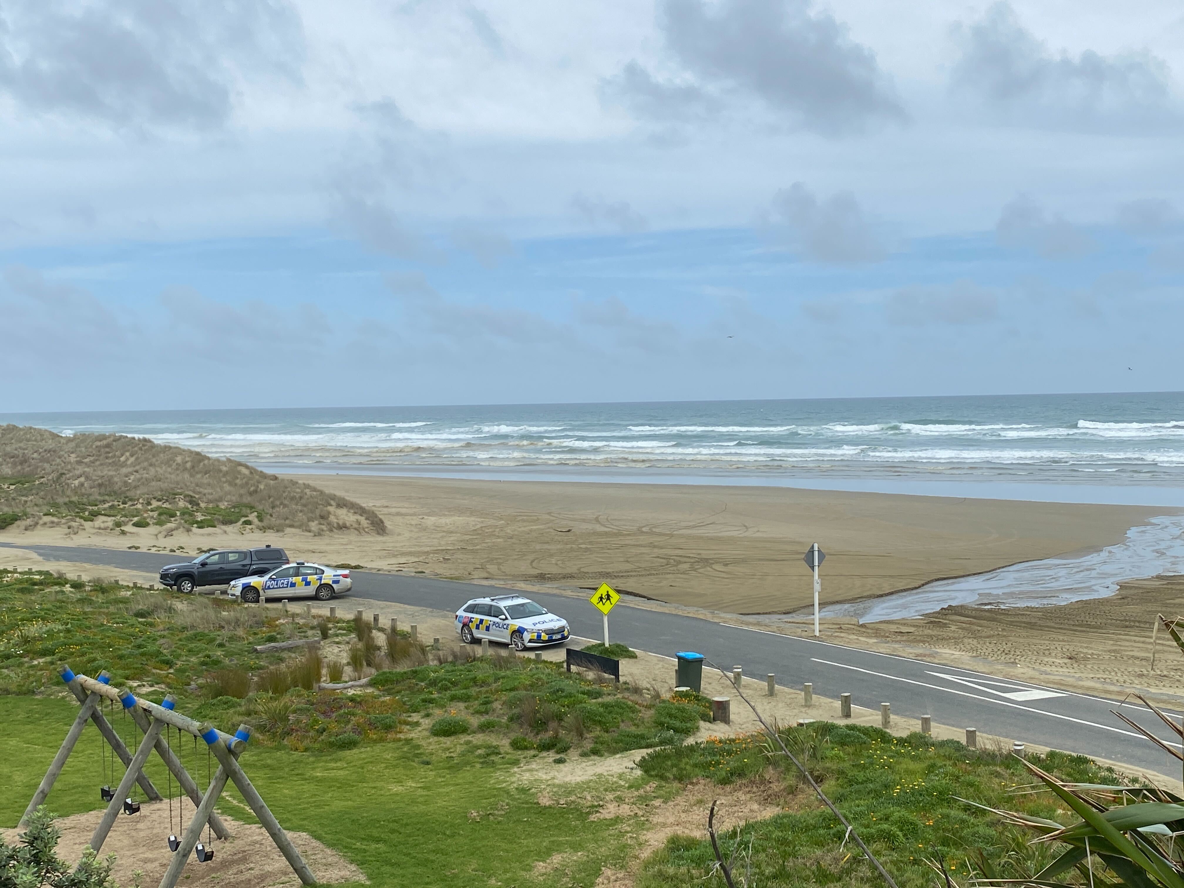 Police continue to investigate after a body was found in a burnt-out vehicle on Ripiro Beach. Photo / Denise Piper