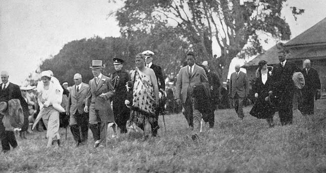 Northern Maori Member of Parliament Taurekareka Hanare escorts Governor-General Lord Bledisloe and his wife onto the land where the Treaty of Waitangi had been signed 94 years earlier. (Te Ara)