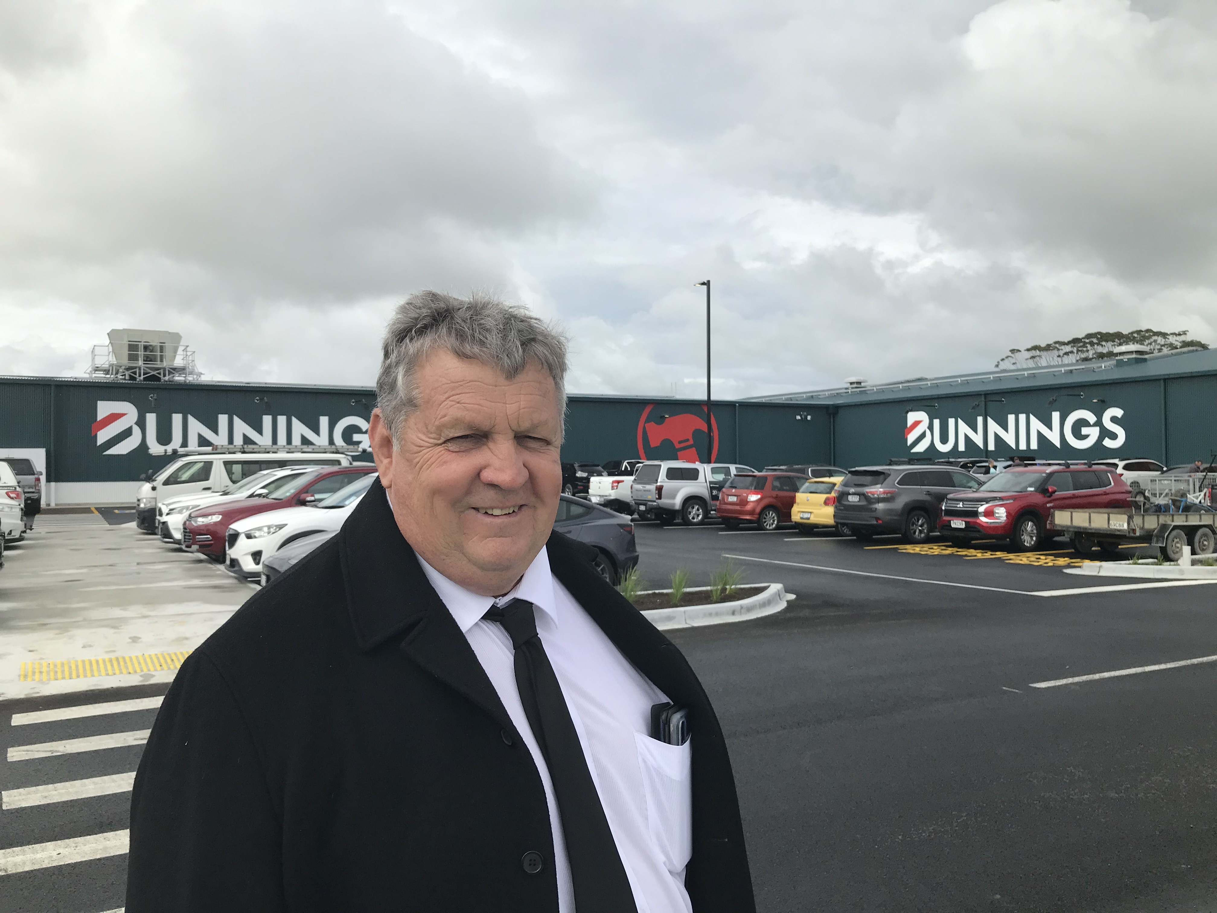 Kaipara Mayor Craig Jepson outside Mangawhai’s newest major retail outlet on its opening day, Friday, November 18. 