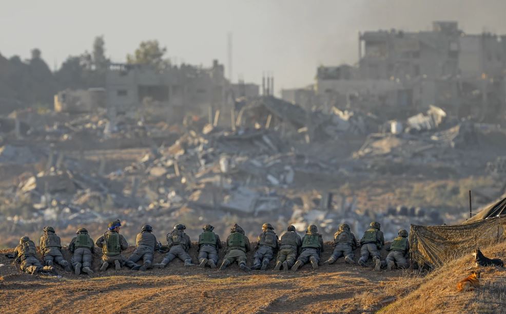Israeli soldiers take positions near the Gaza Strip border, in southern Israel. Photo / AP