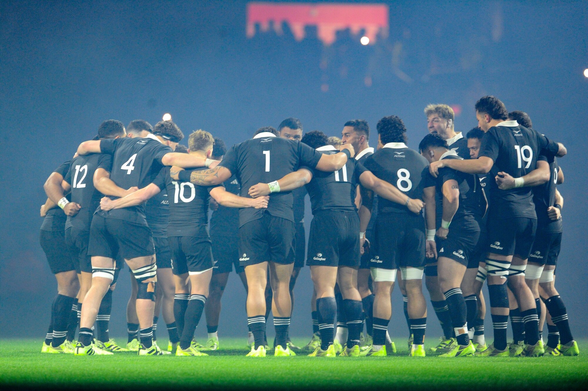 The All Blacks huddle under new coach Dave Rennie, who says Super Rugby Pacific form will decide selection. Photo / Getty Images
