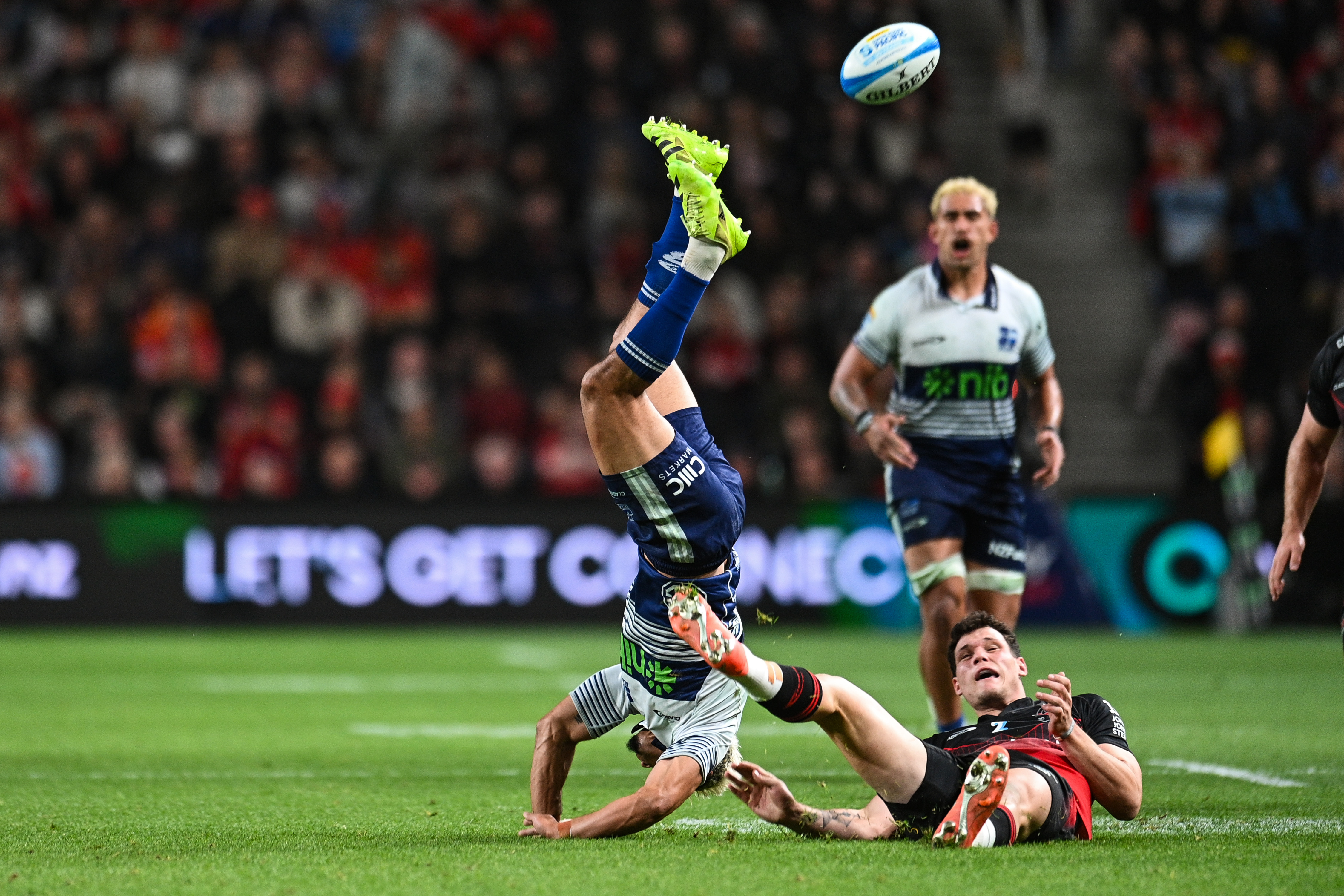 Stephen Perofeta goes down after a collision in the Blues match against the crusaders. Photo / Photosport