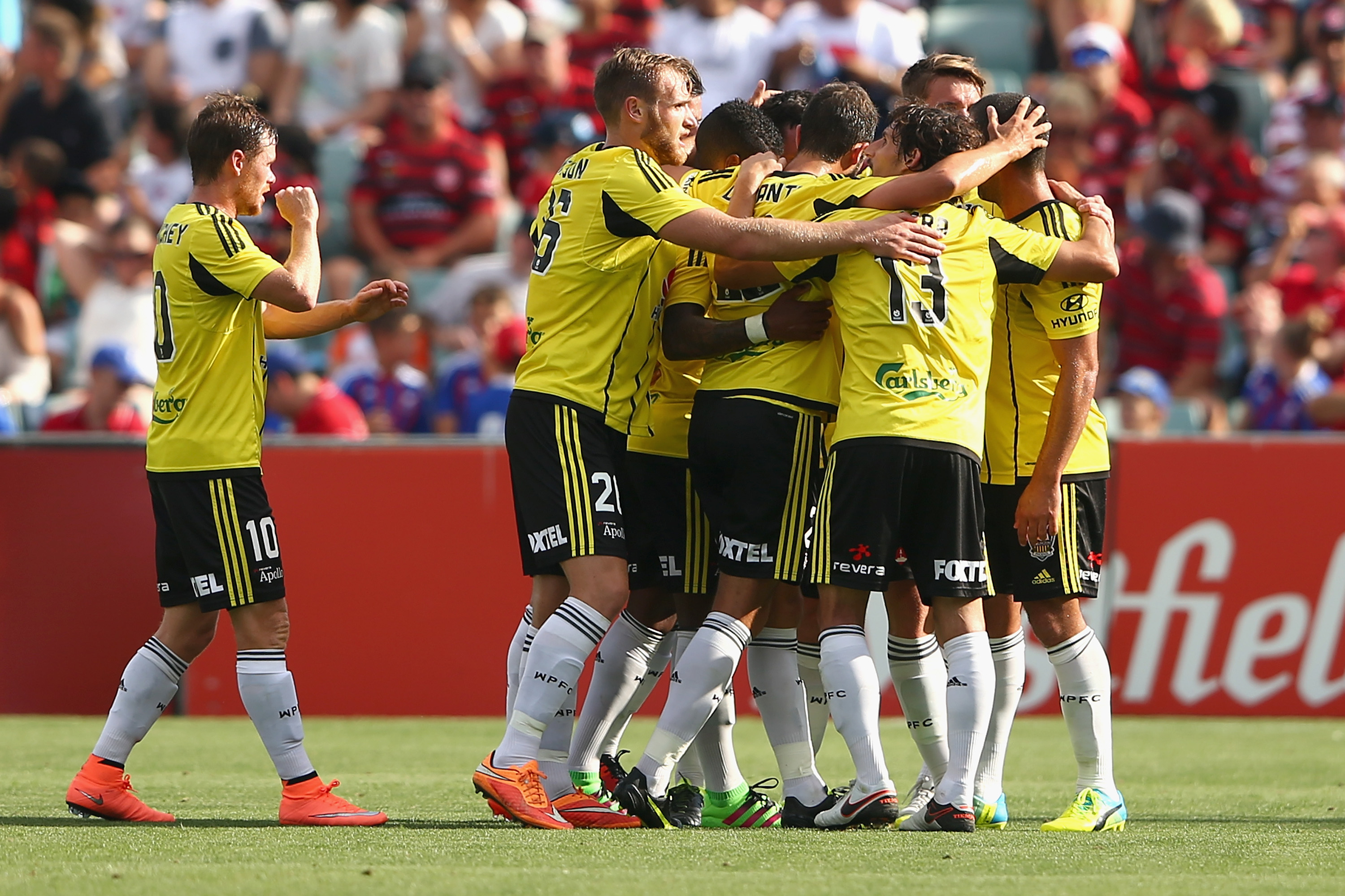 Blake Powell of the Phoenix celebrates with team mates after scoring a third goal during the round 19 A-League match against the Western Sydney Wanderers. Photo / Getty Images.
